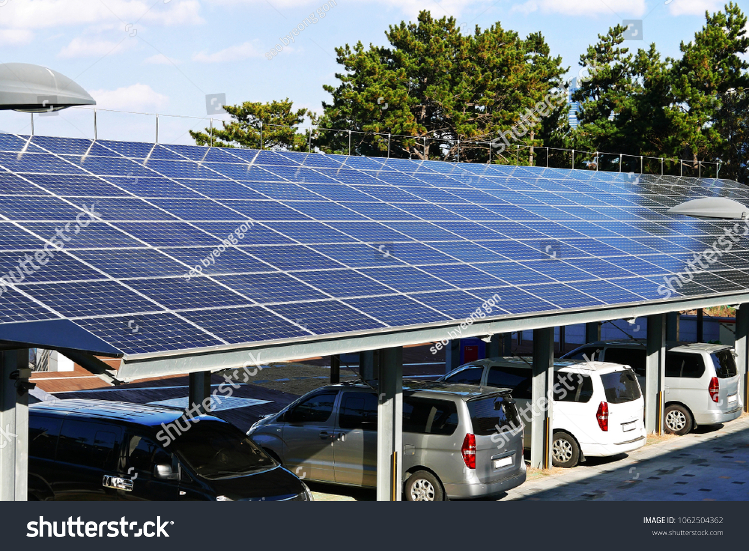 A solar power plant installed on top of a parking lot #1062504362