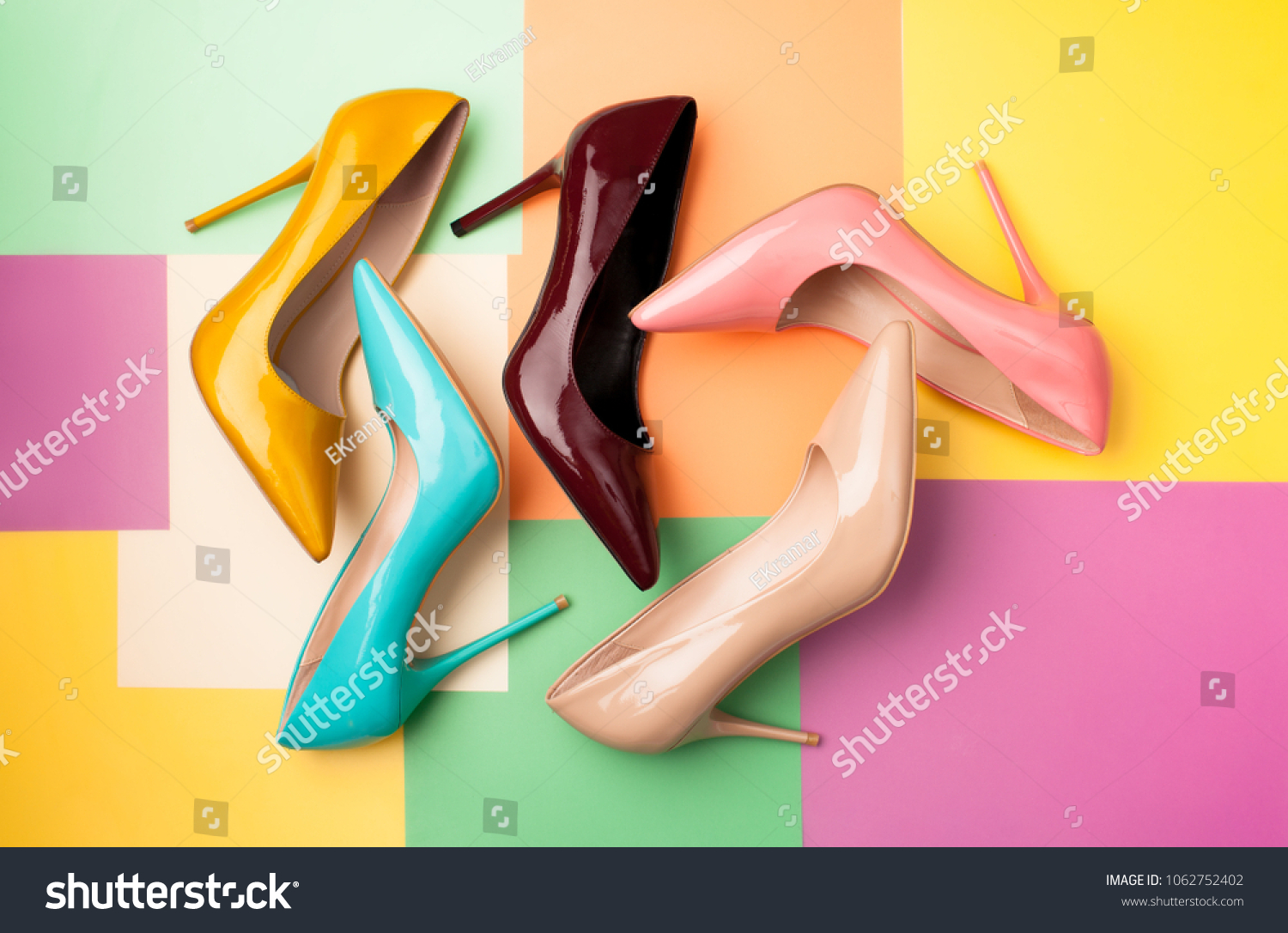 Bright colored women's shoes on a solid background. Copy space text. #1062752402