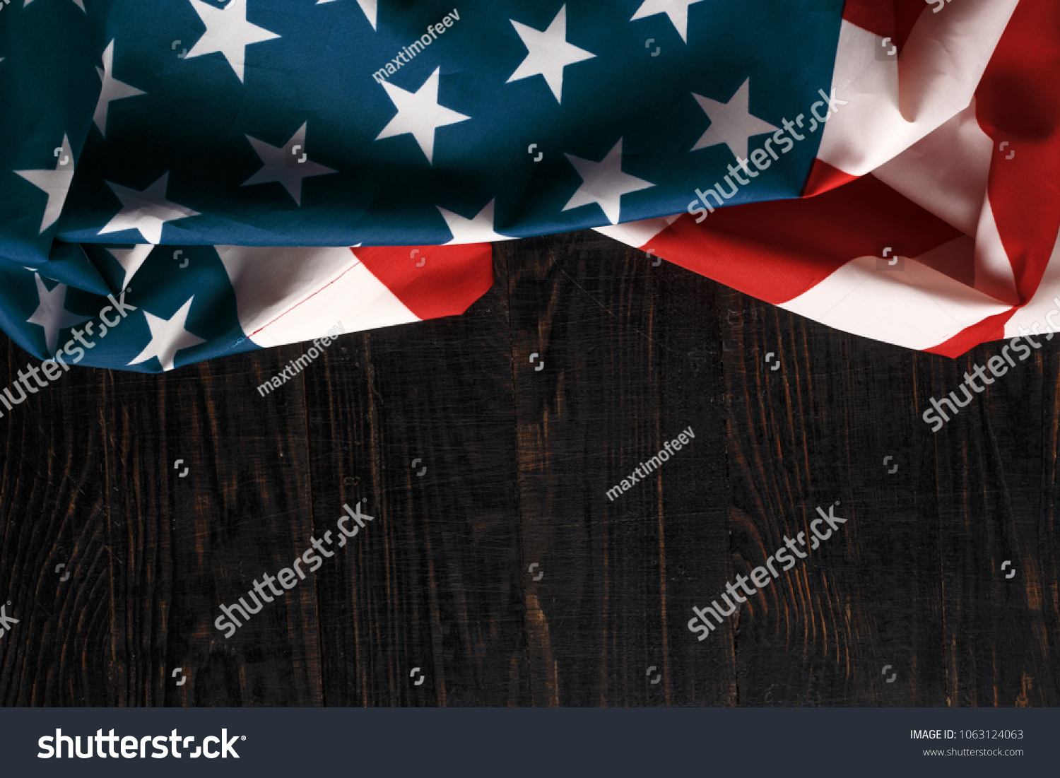 American flag on a antique wooden platform. #1063124063