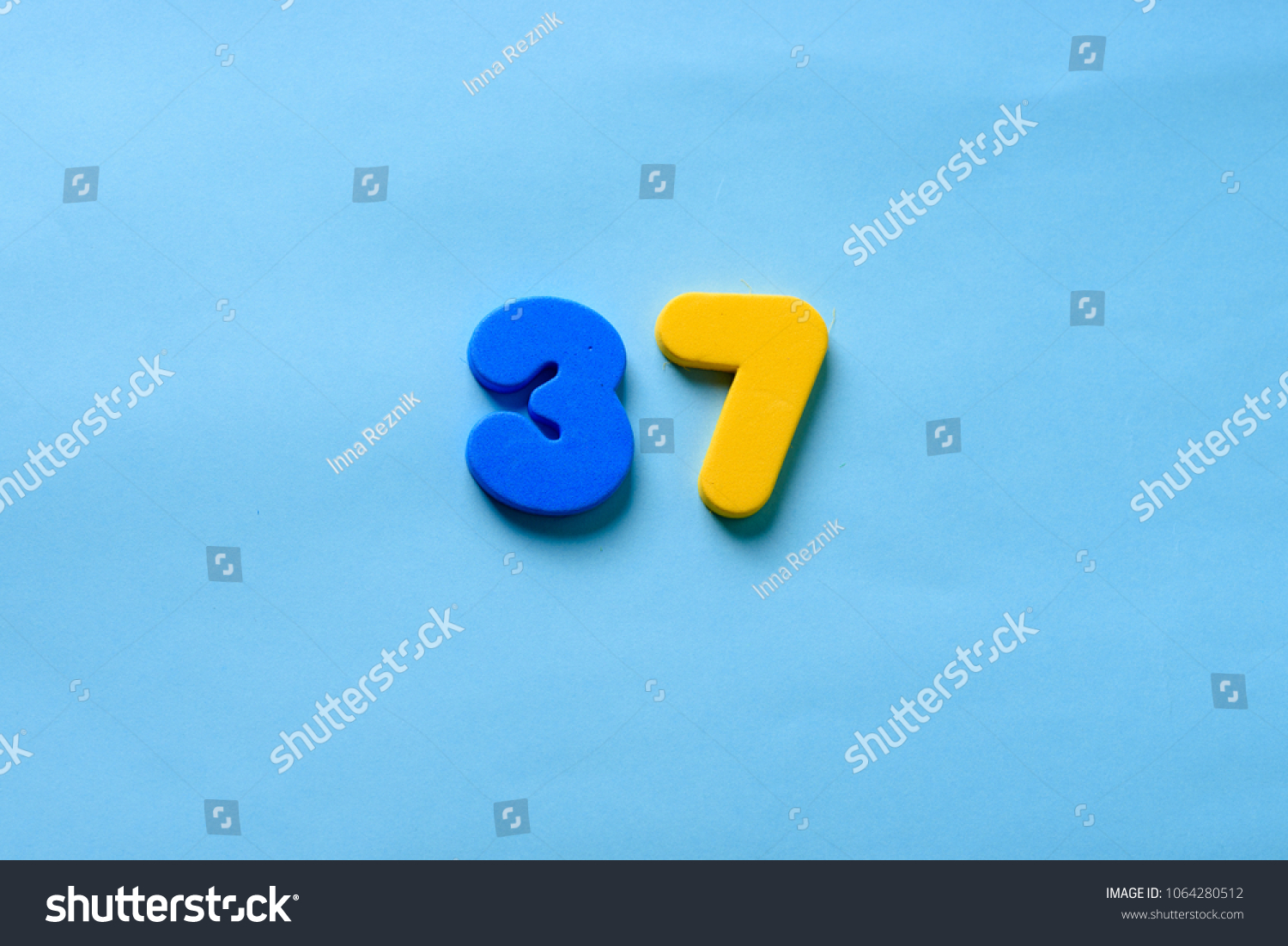 37 years old celebrating classic logo. Colored happy anniversary 37 th template yellow blue numbers. Greetings celebrates card. Traditional framed digits of ages. Sale, special prize, % off concept. #1064280512