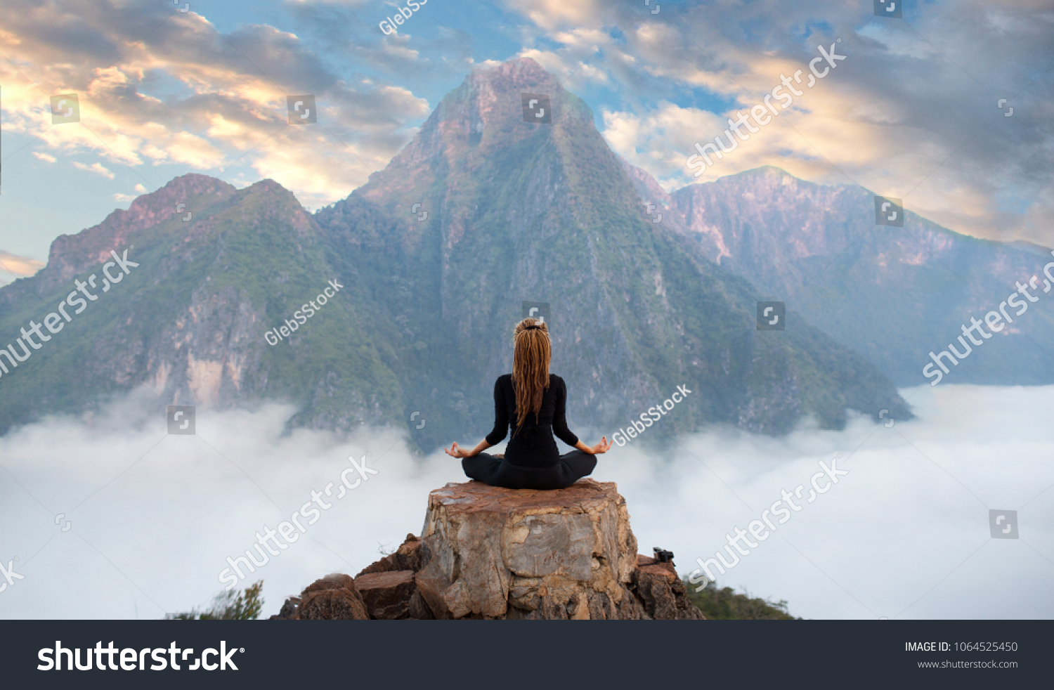 Serenity and yoga practicing at mountain range,meditation  #1064525450