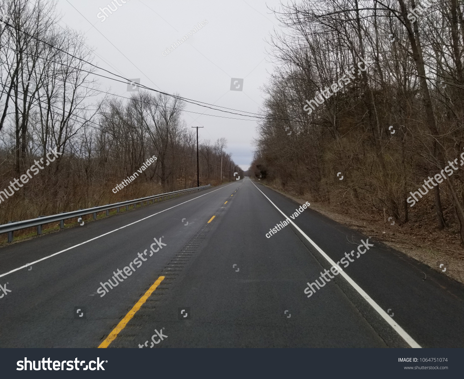 road with and without snow #1064751074