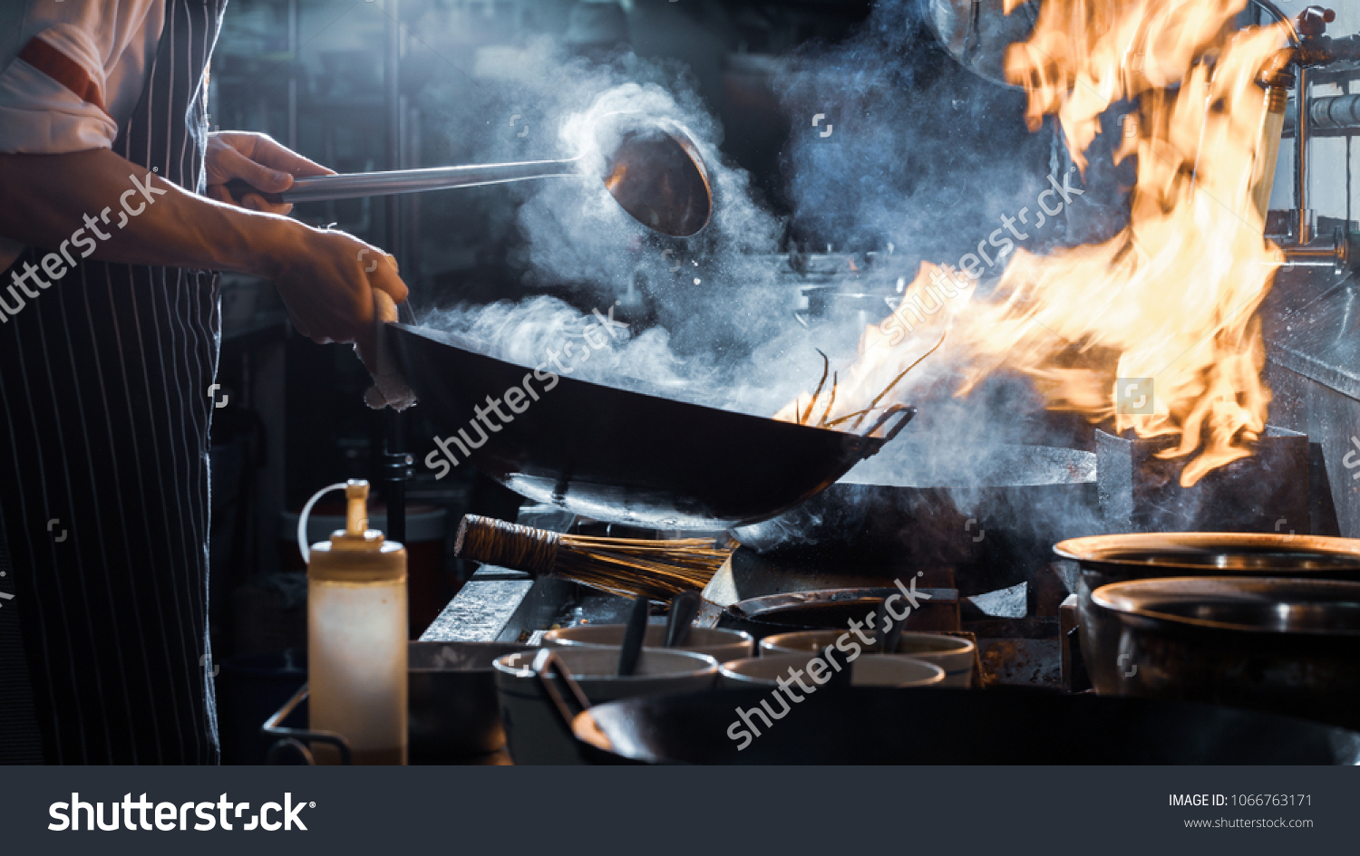 Chef is stirring vegetables in wok, vintage filter #1066763171
