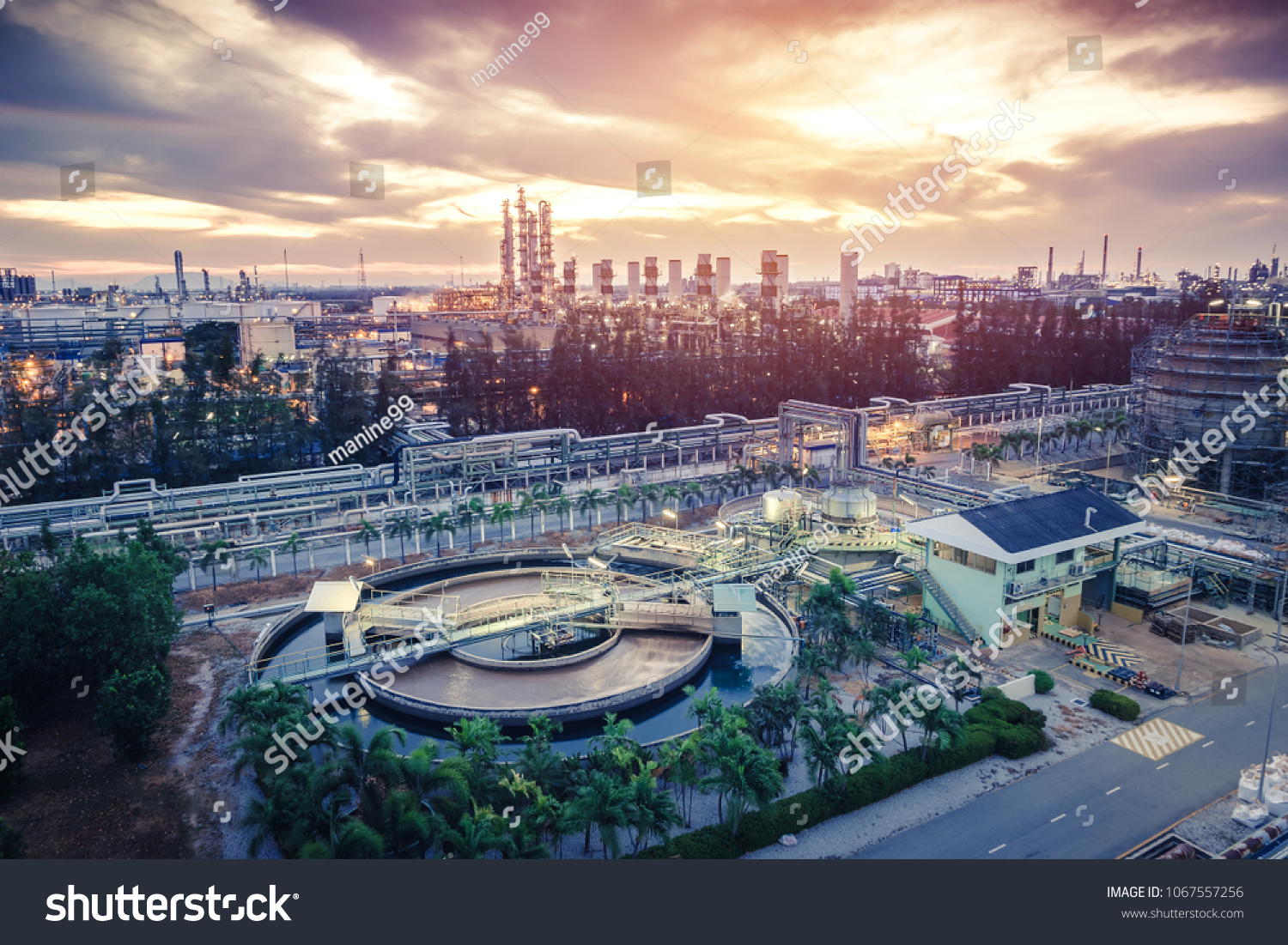 Petrochemical industrial estate on sunrise sky background with Wastewater treatment plant #1067557256