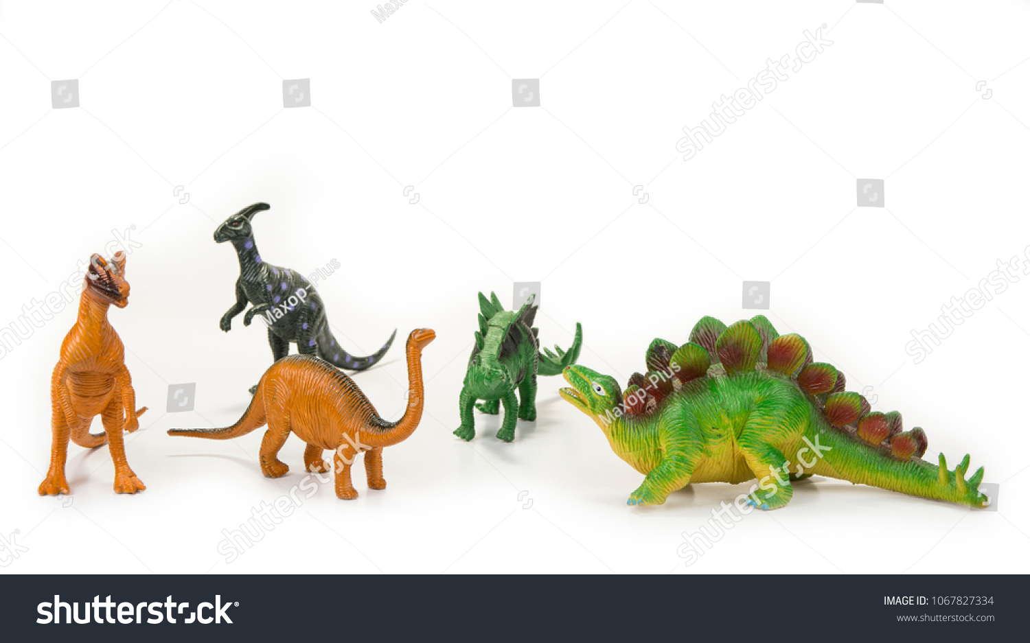 Dinosaur toy with open mouth on the white #1067827334