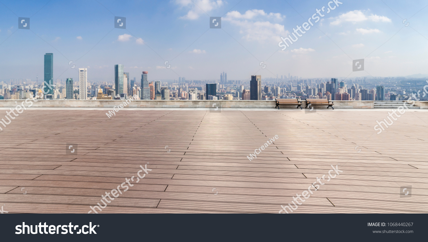 Panoramic skyline and buildings with empty concrete square floor
 #1068440267