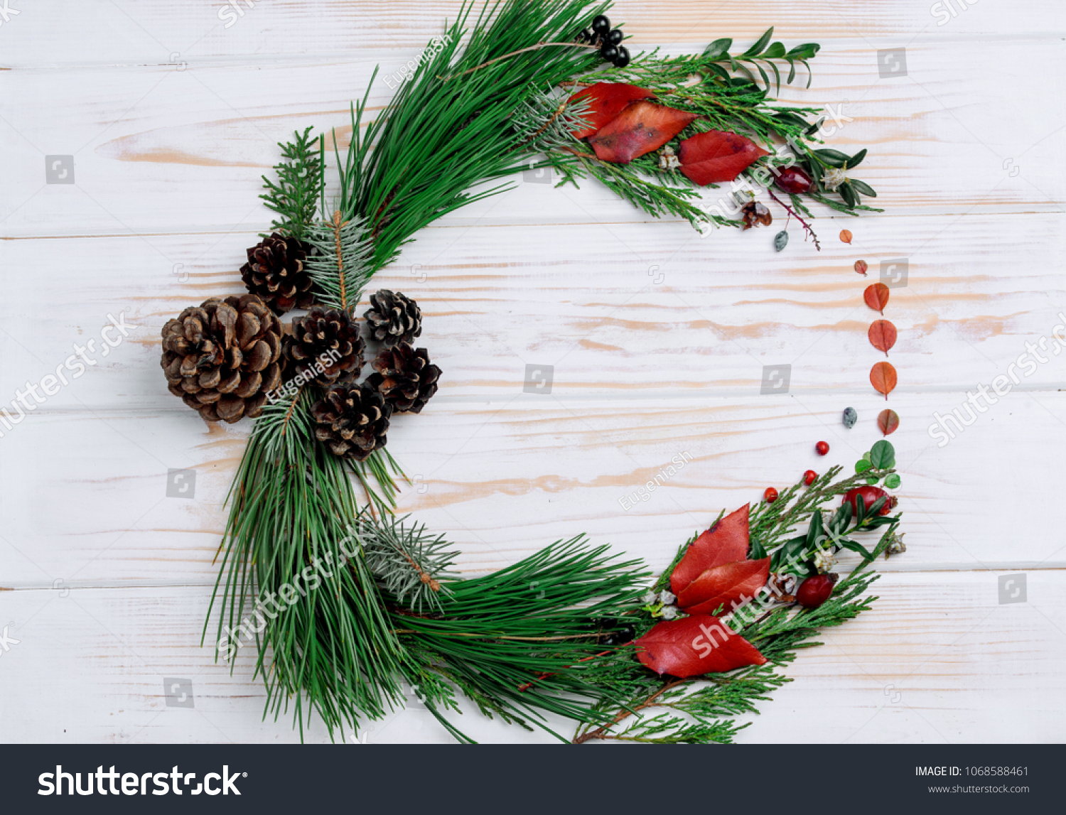 New Year's wreath of twig of twigs and carrots on the table #1068588461