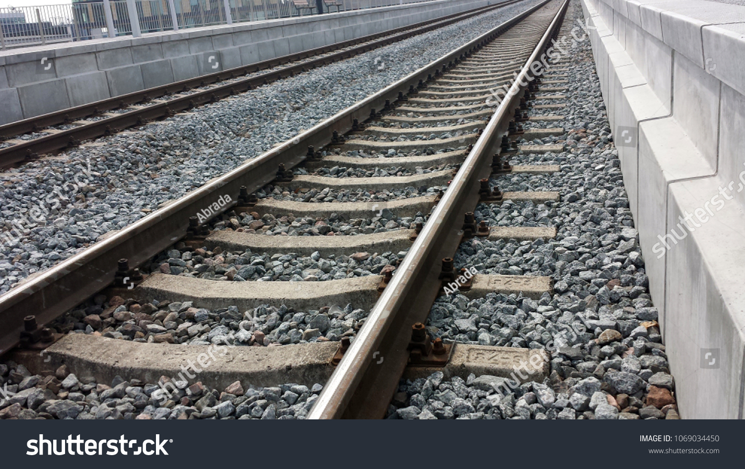 Two railroad tracks between platforms, closeup. #1069034450