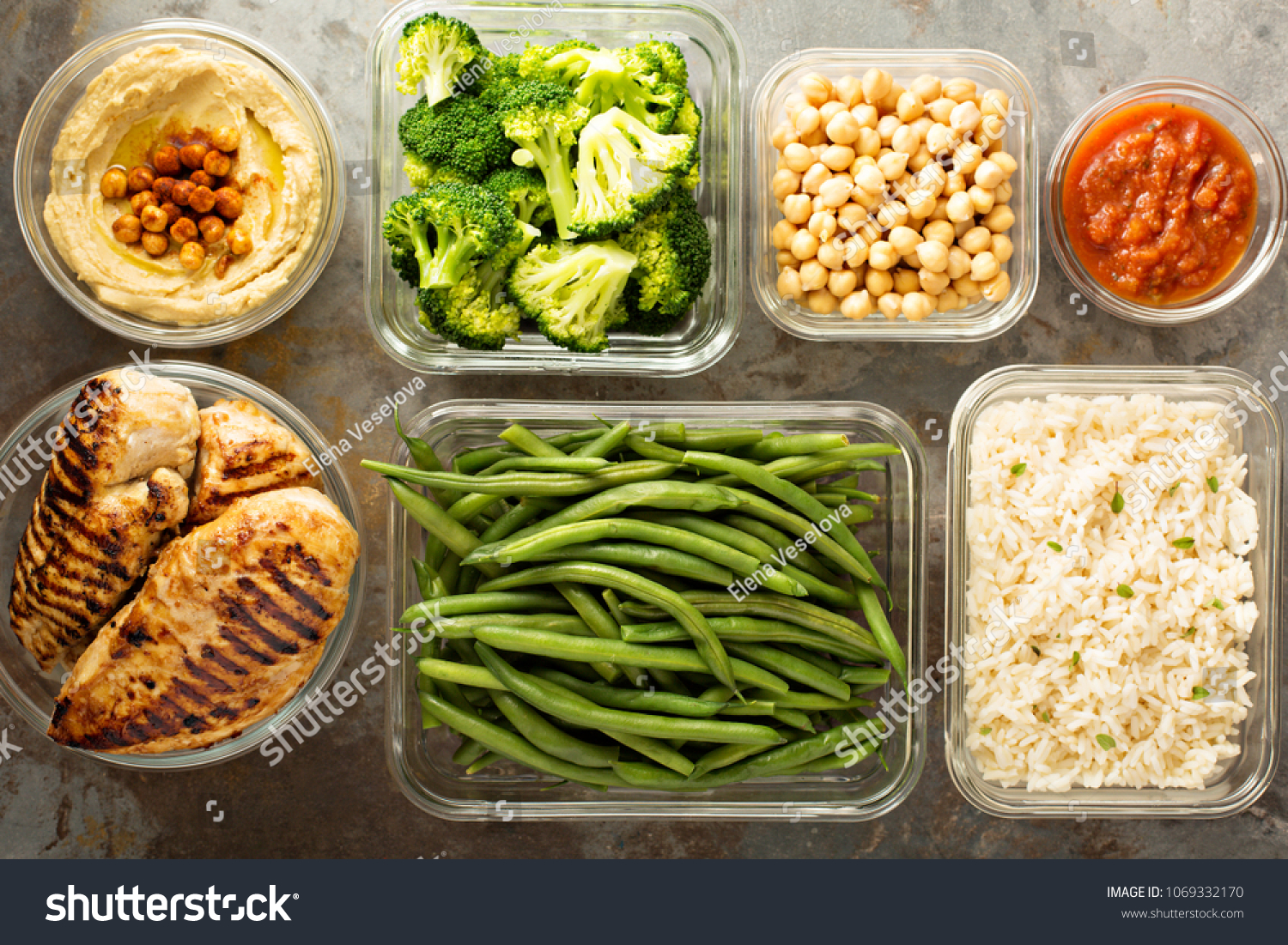 Grilled chicken meal prep with cooked rice and vegetables #1069332170