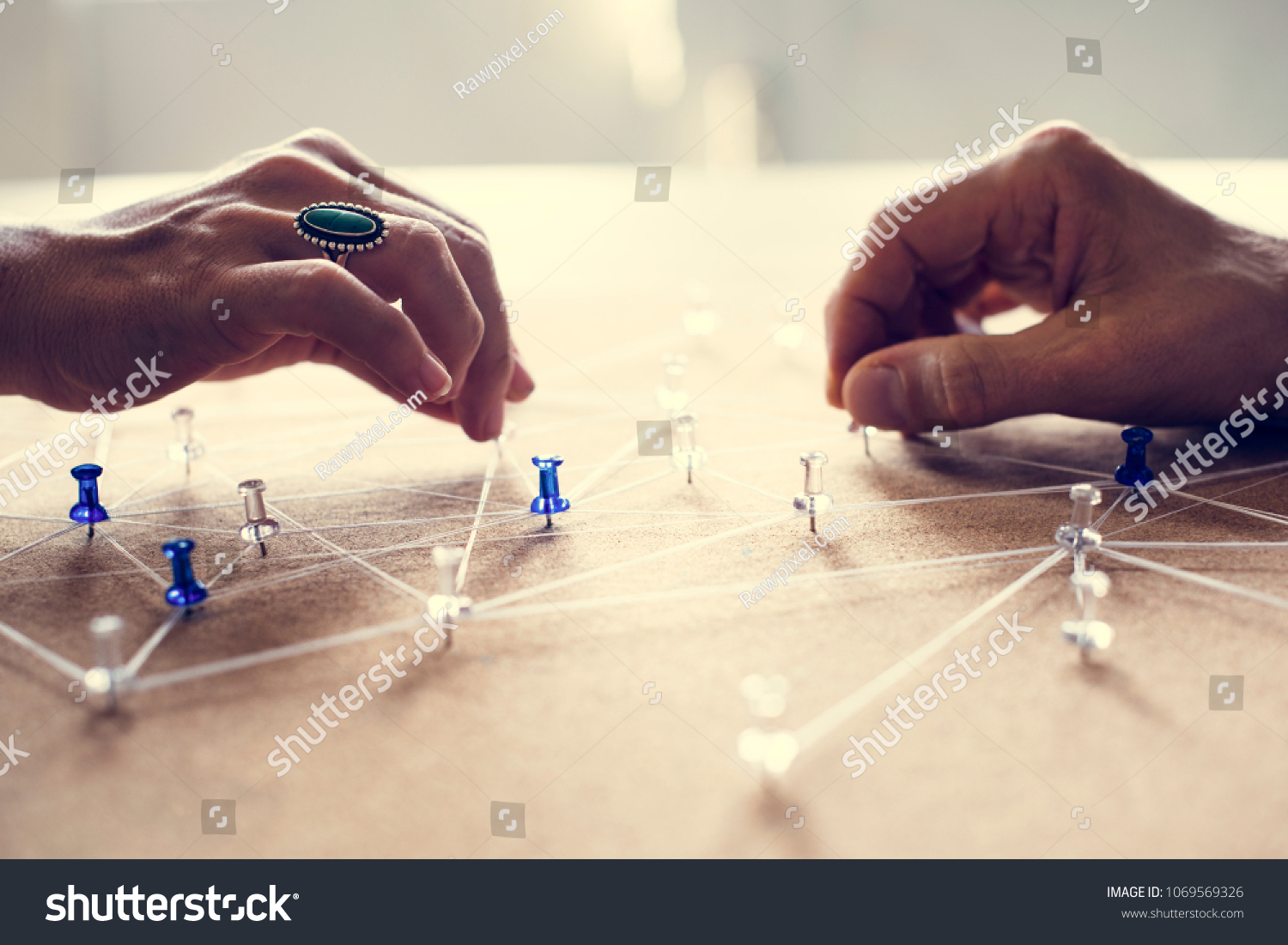 Hands holding connecting pin network #1069569326