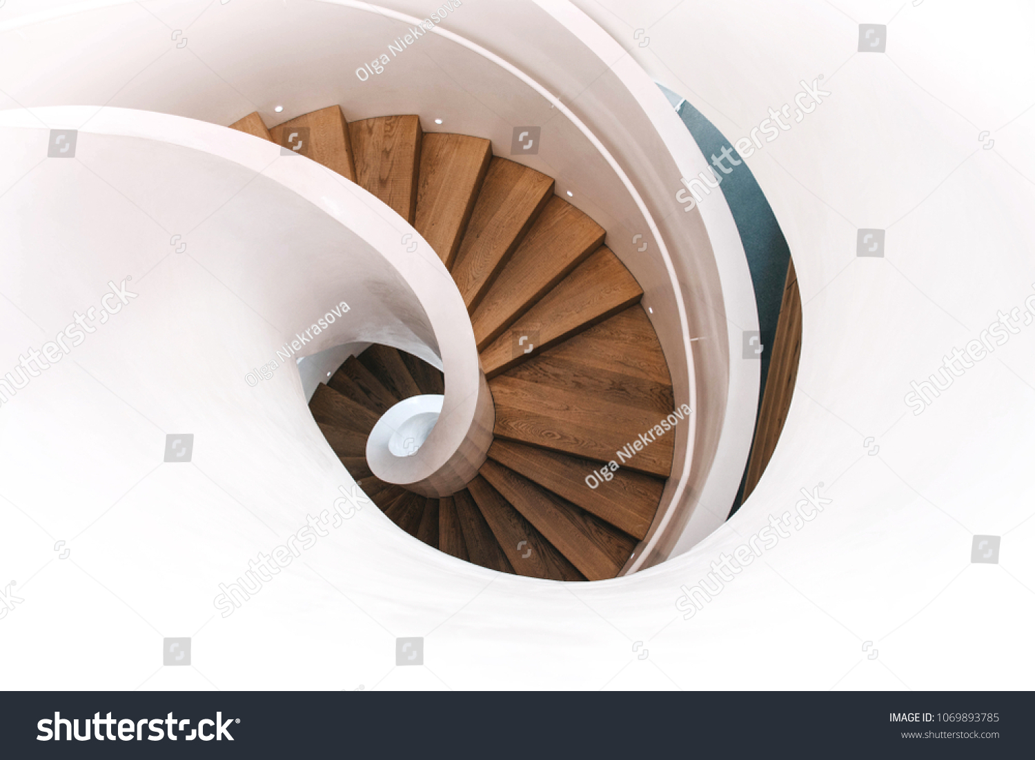 Indoor modern spiral staircase in white. Top view. #1069893785