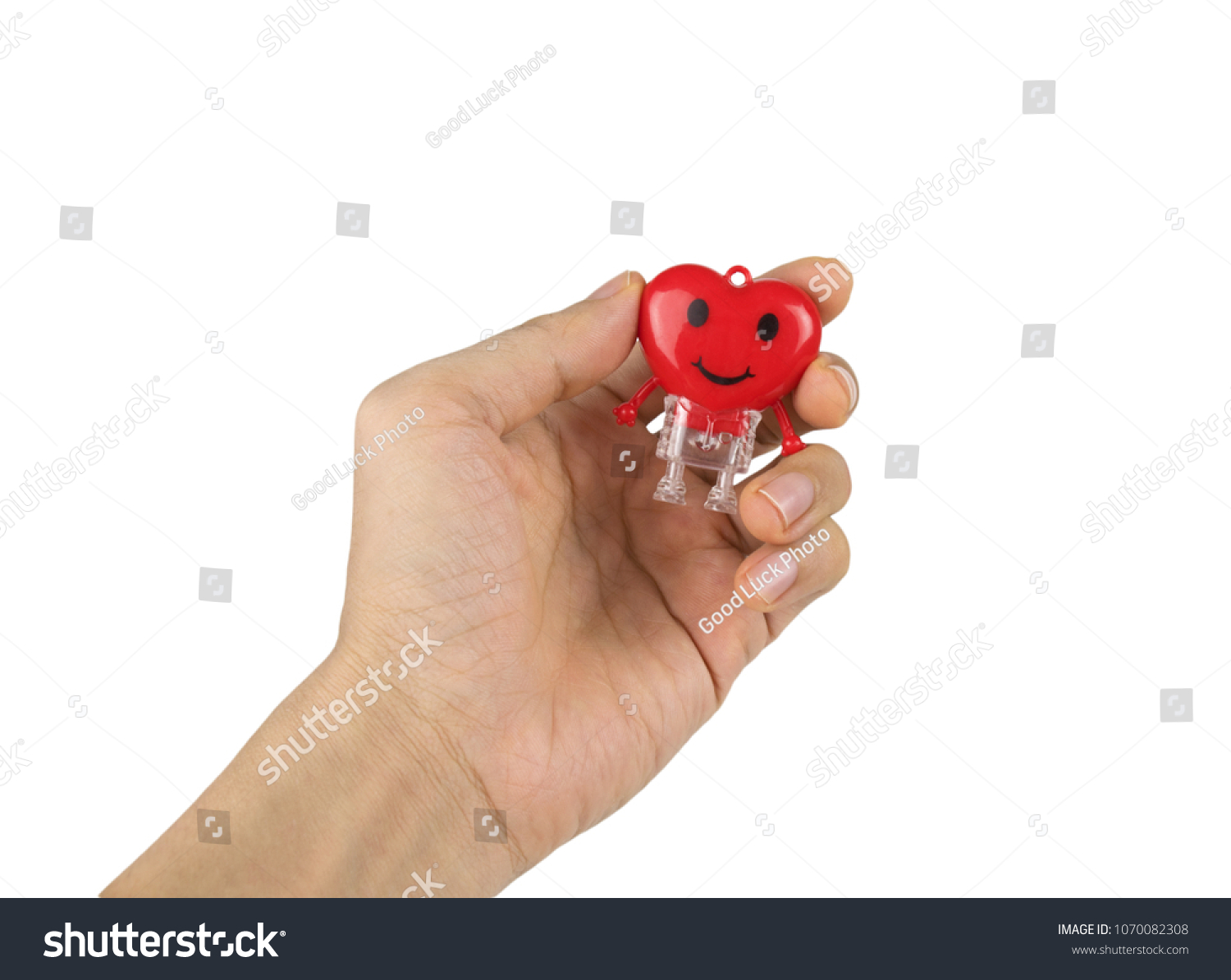 Heart red toy on hand isolated on white background with clipping path.Concept screening and care for the heart or valentine. #1070082308