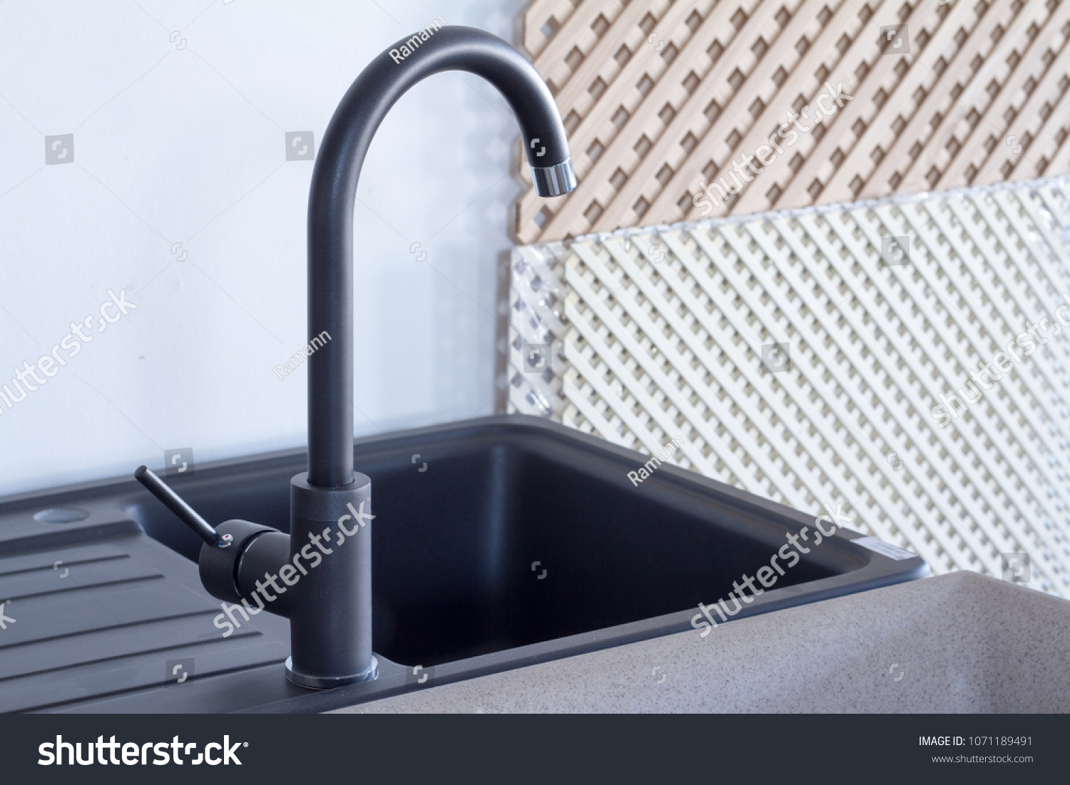 Modern kitchen and bathroom water faucets in the store #1071189491