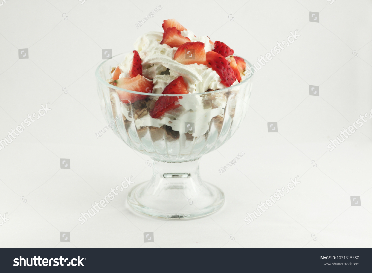 whipped cream and strawberry in a glass bowl #1071315380