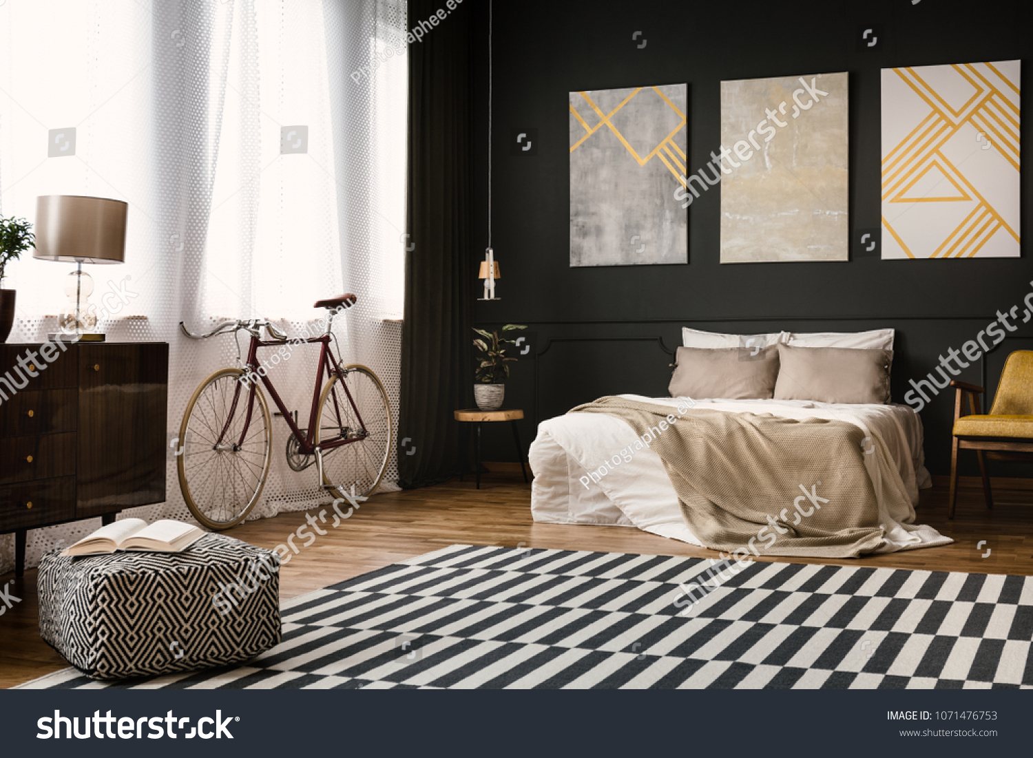 Vintage room interior with bed, bike, carpet on the floor and pouf #1071476753