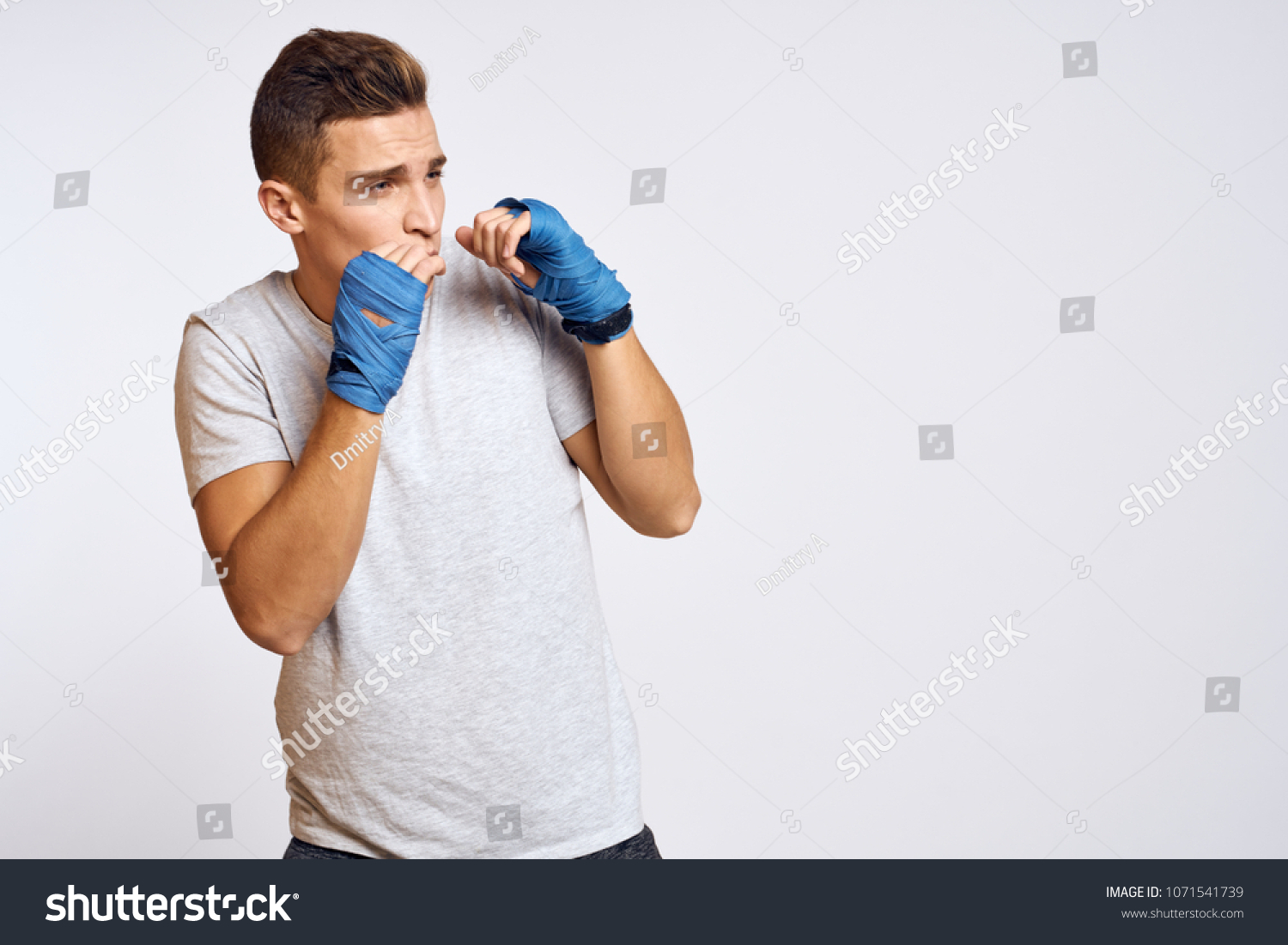   boxer with protection on hands, boxing                              #1071541739