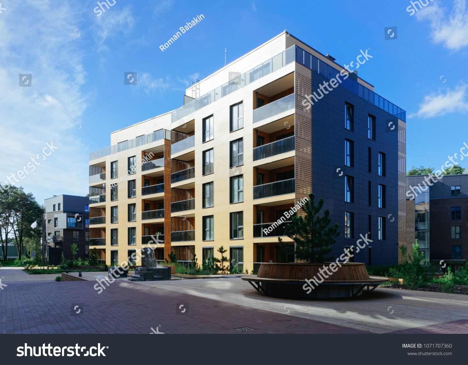 Pine tree at architectural complex of residential buildings. And outdoor facilities. #1071707360