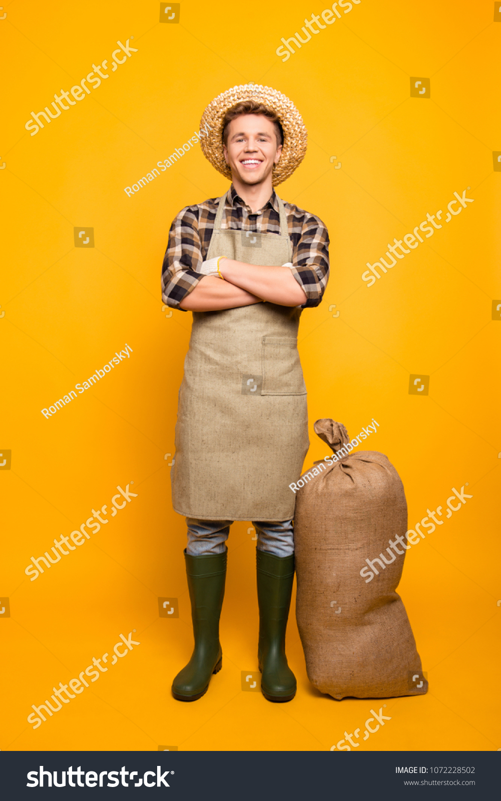 Non-gmo gmo-free people person many brown healthcare entrepreneur concept. Vertical full-length portrait of friendly glad with crossed folded arms man isolated on background wearing hay hat #1072228502