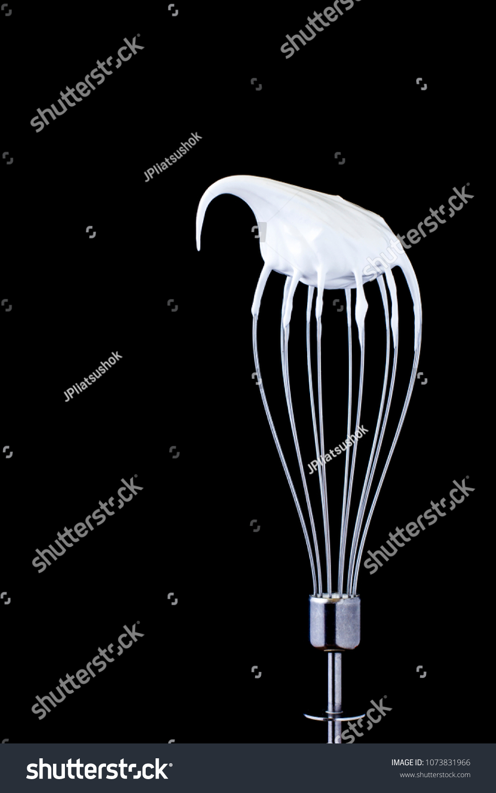 Metal whisk with whipped egg whites on black background #1073831966