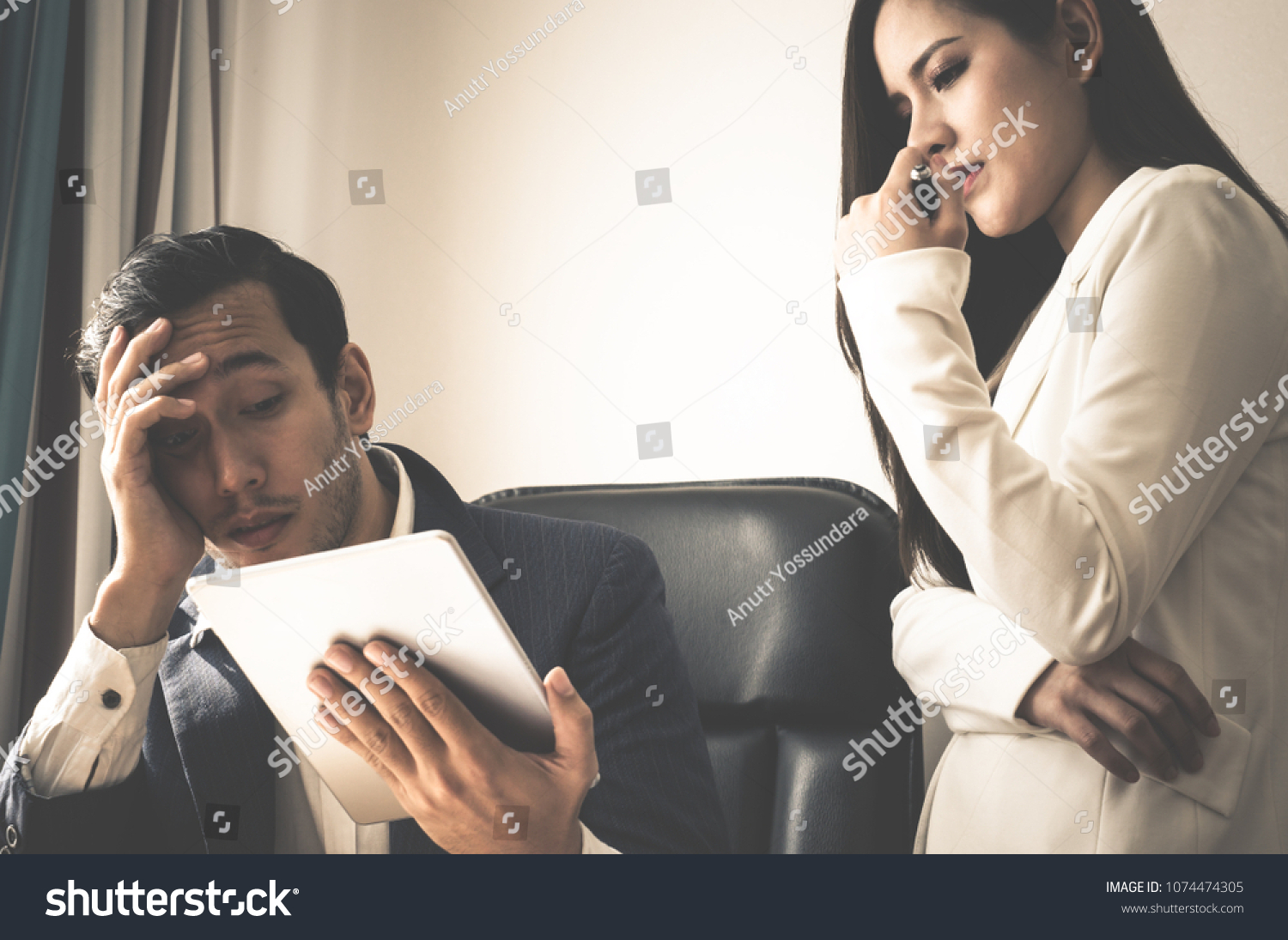 Boss and secretary is stress out with report on tablet #1074474305