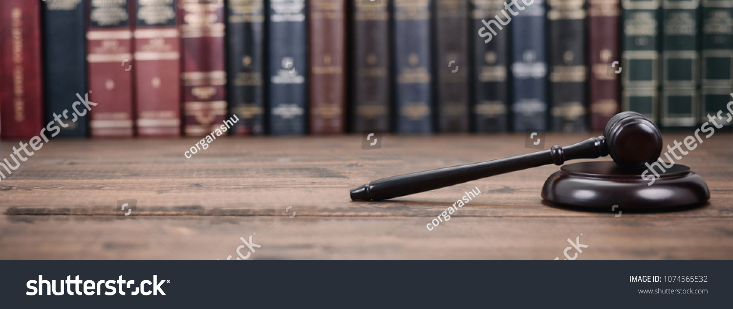 Law and Justice, Legality concept, Judge Gavel on a wooden background, Law library concept. #1074565532