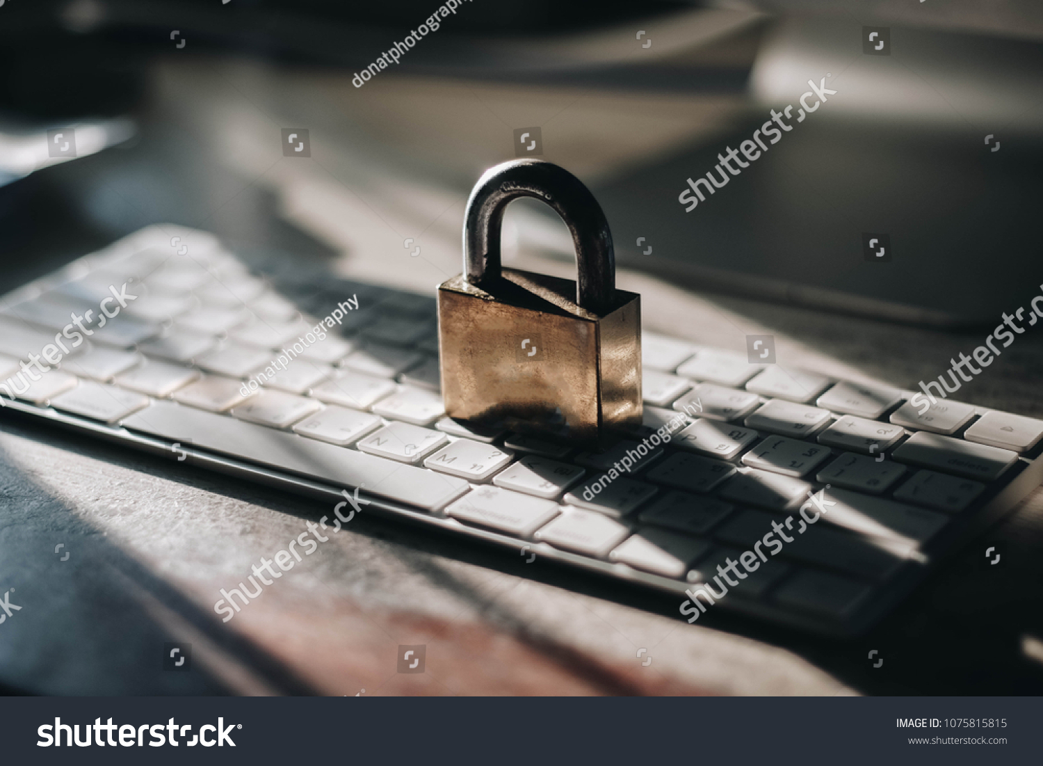 Computer security concept with a closed padlock on the keyboard #1075815815