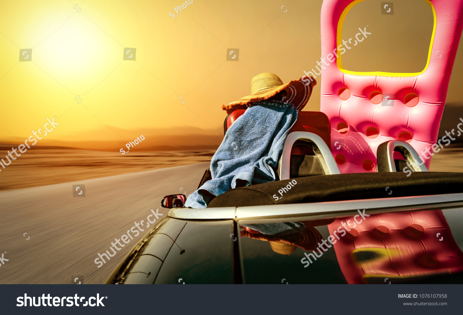 Summer car and road with sunset of golden colors. Free space for your text.  #1076107958