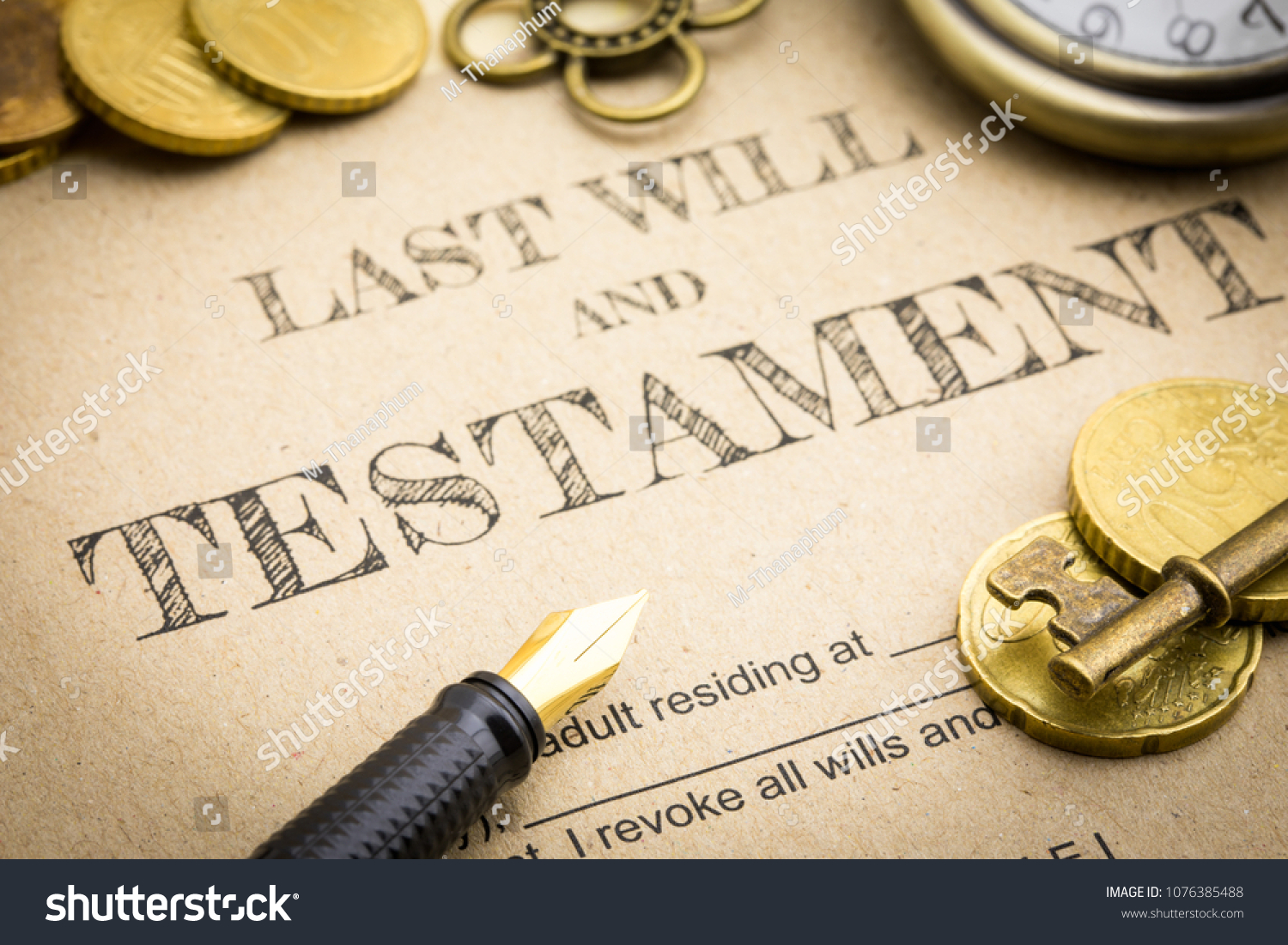 Close up Vintage of Black pen, Gold coins money, Vintage gold key and vintage clock on Last will and testament document concept #1076385488