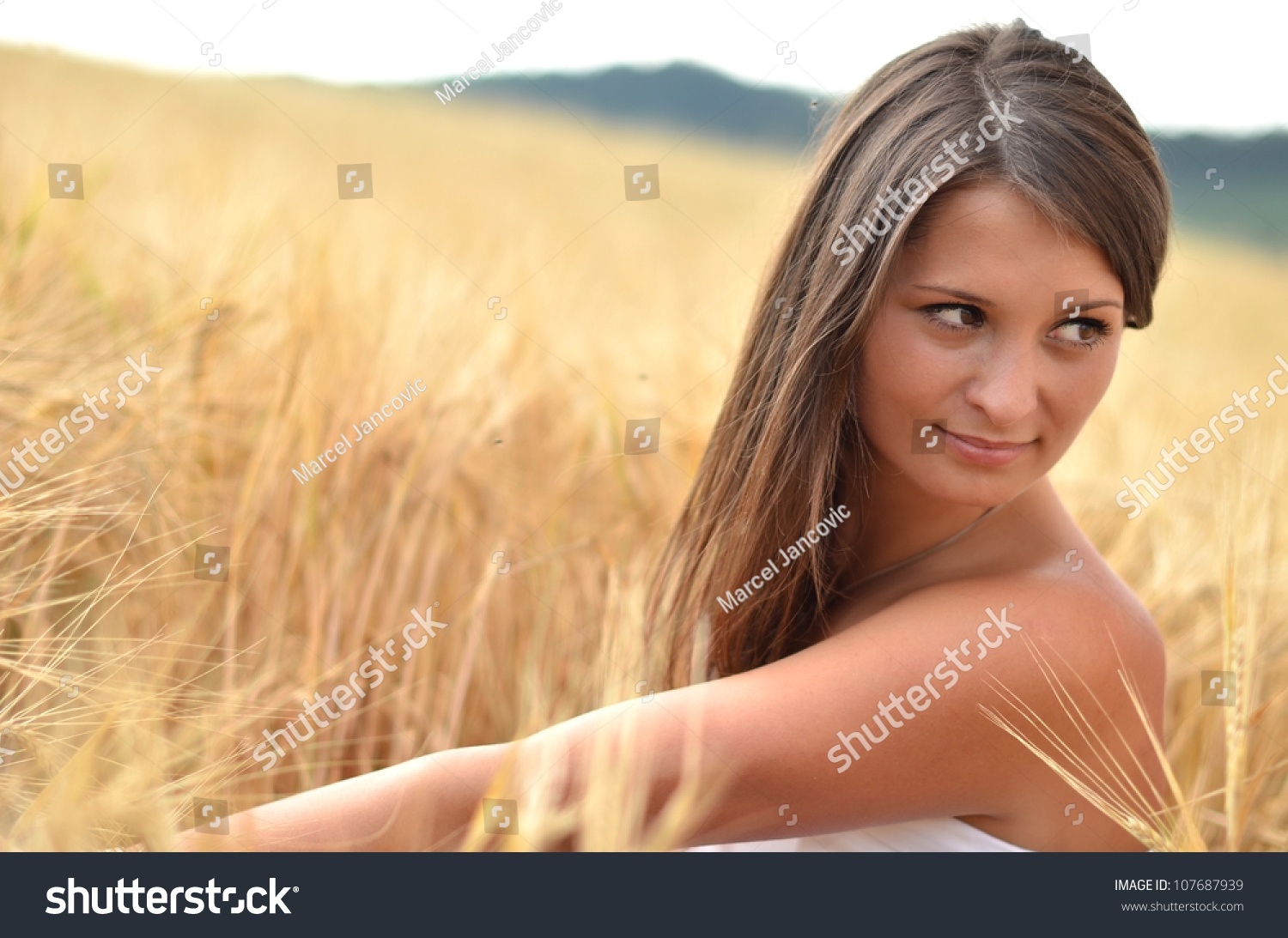 woman in golden wheat #107687939
