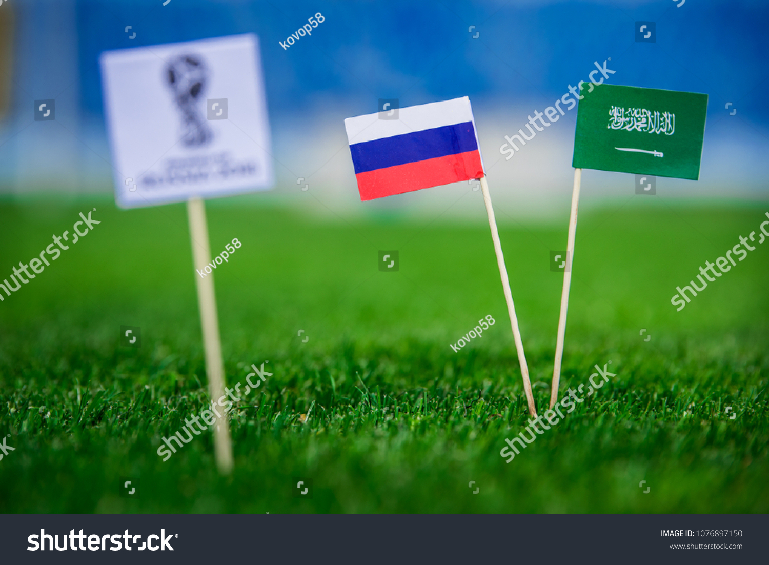 MOSCOW, RUSSIA - APRIL, 24, 2018: Russia - Saudi Arabia, Group A, Thursday, 14. June, Football, World Cup, Russia 2018, National Flags on green grass, white football ball on ground. #1076897150