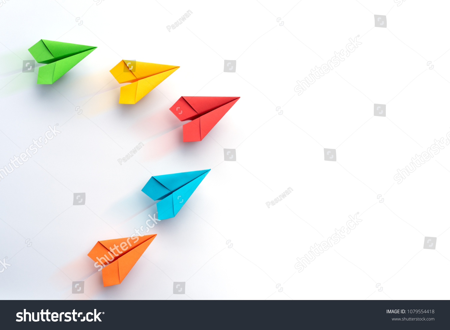 Paper plane on white background. Business competition concept. #1079554418