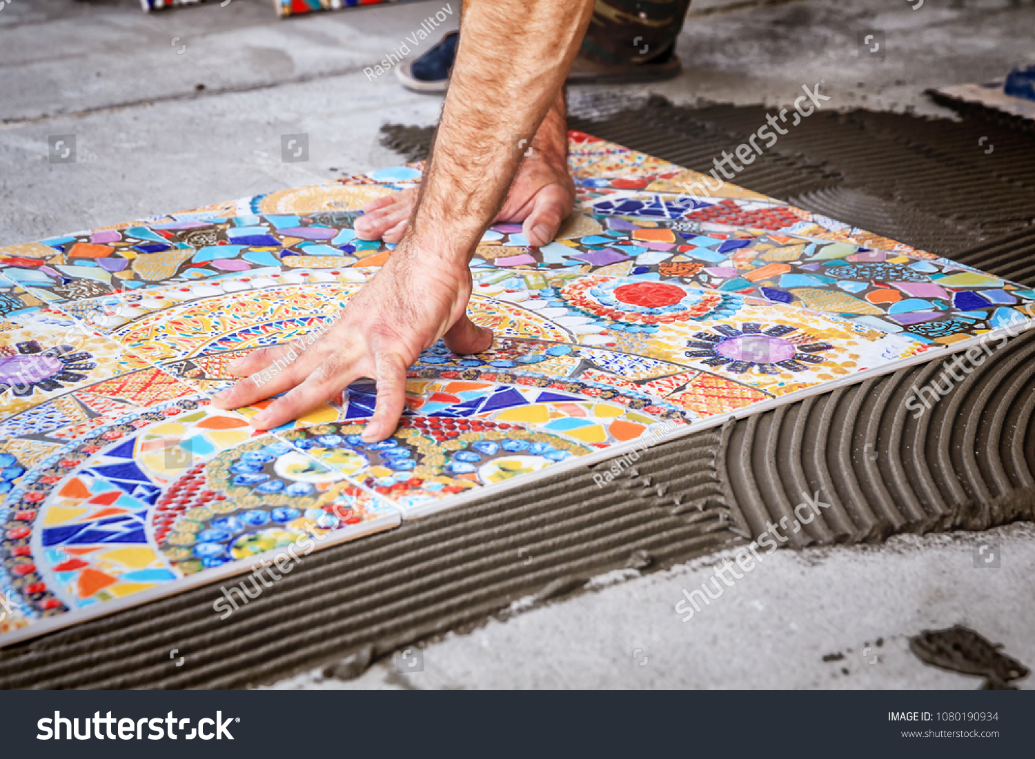 process of laying floor ceramic tiles, installation of tiles on the glue #1080190934