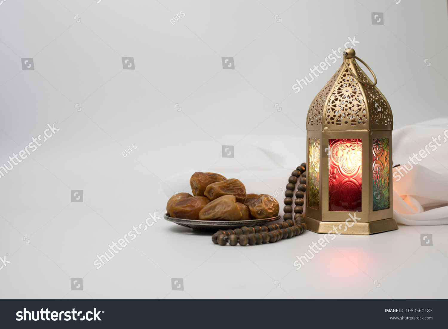 Lantern, Dates fruit and rosary beads photo for Ramadan and Eid greeting. #1080560183