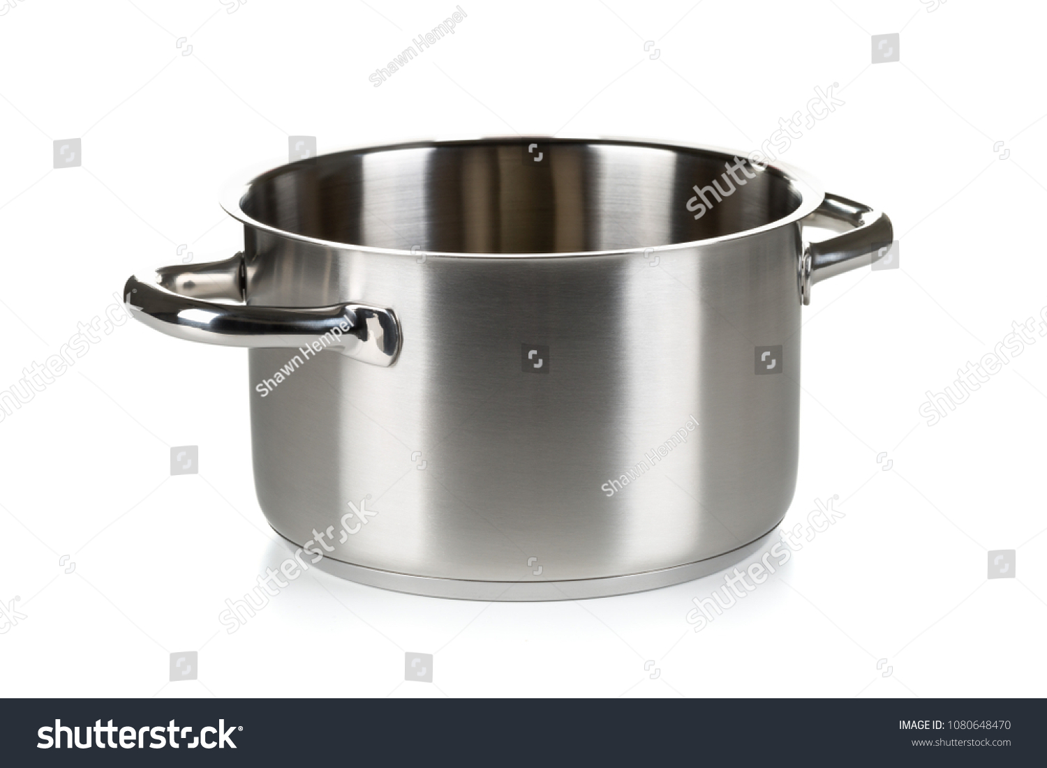 Open stainless steel cooking pot over white background #1080648470