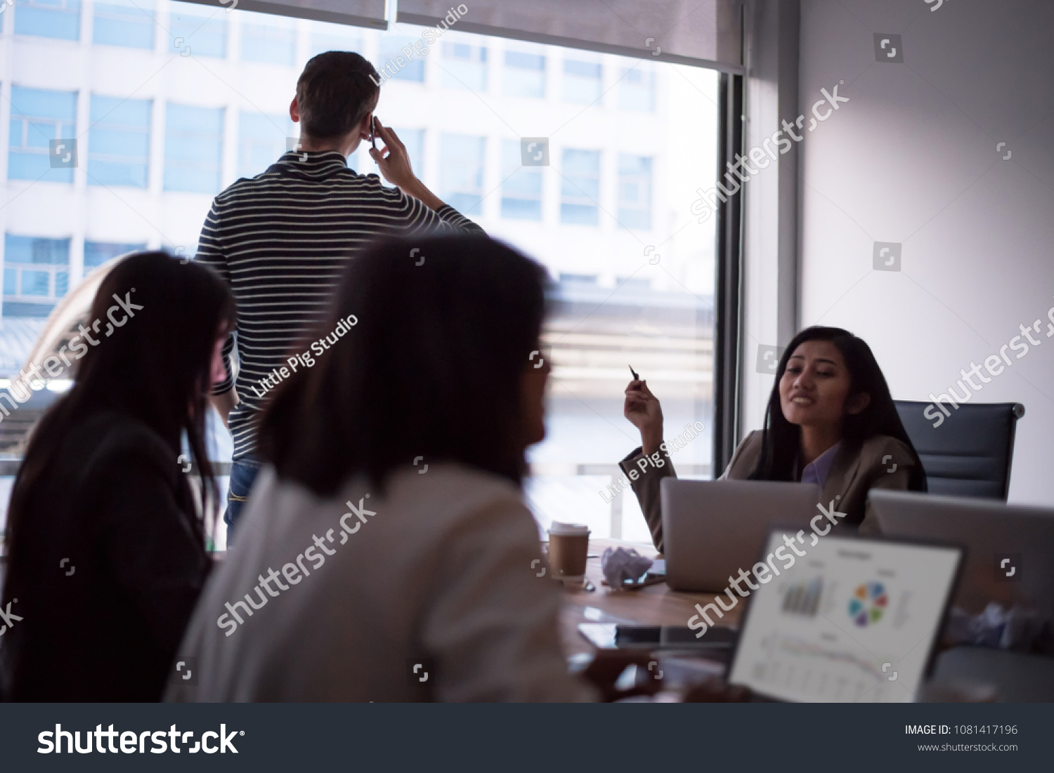 Employees gossip boss while he talking on phone. setup studio shooting. #1081417196