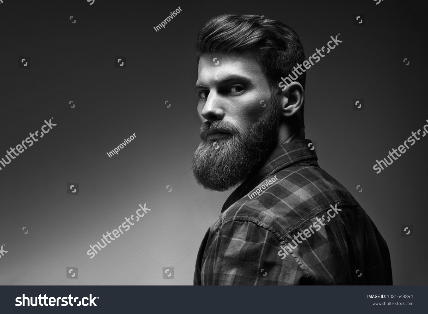 Black and white photo of bearded stylish businessman Handsome confident perfect hairstyle man indoor . #1081643894