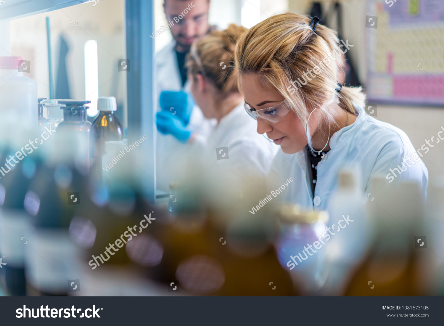 Beautiful young woman scientist in laboratory working. Young female scientist doing some research. #1081673105