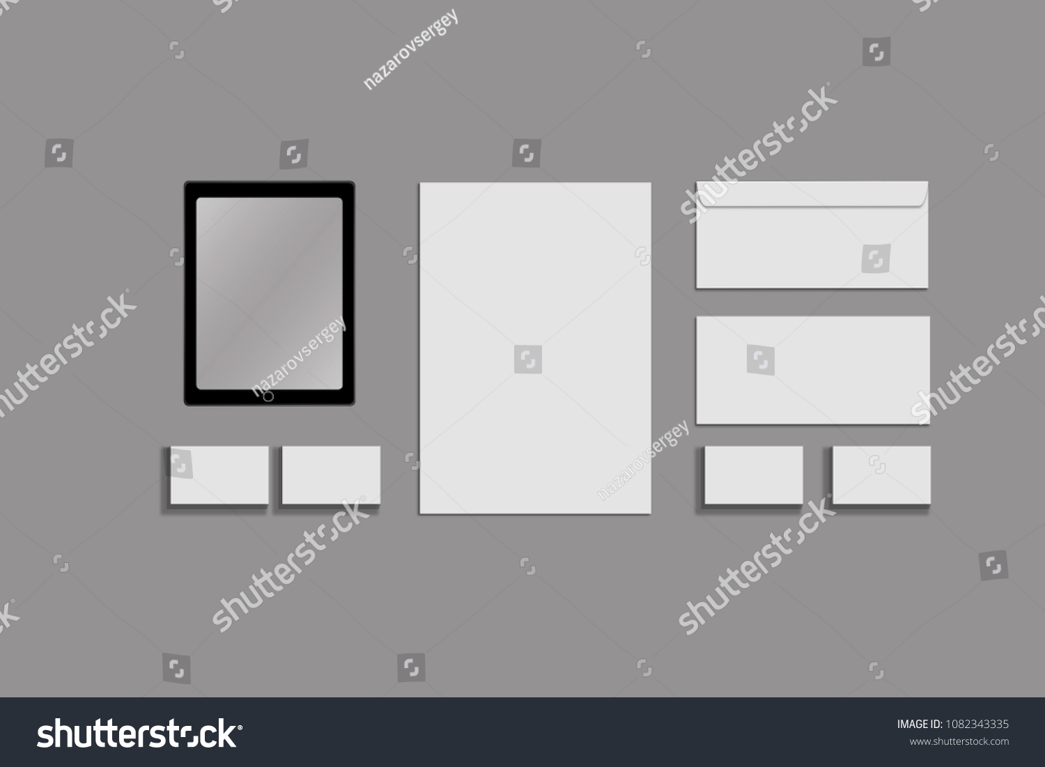 Black white and gray color mock-up of stationery, a template for brand identification on a grey background. Envelopes, sheets of paper #1082343335