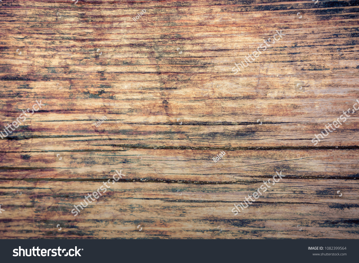 Vintage stained wooden wall background texture #1082399564