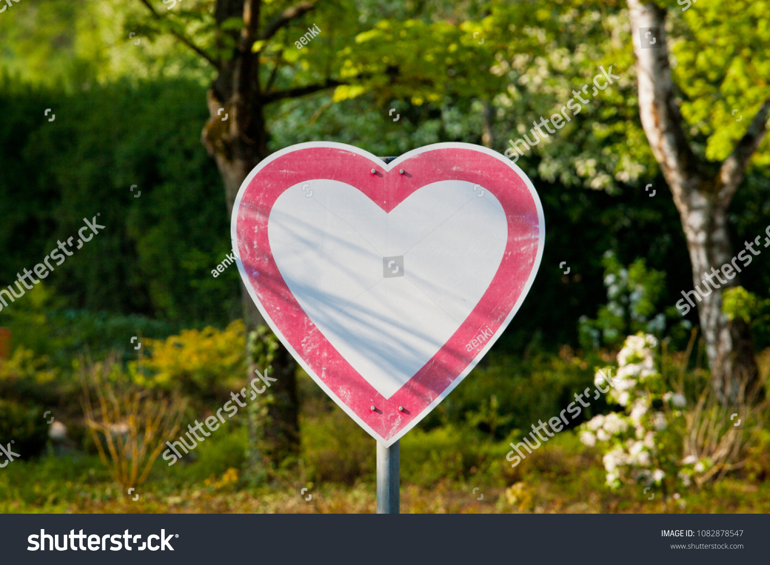 Heart shaped road sign  #1082878547