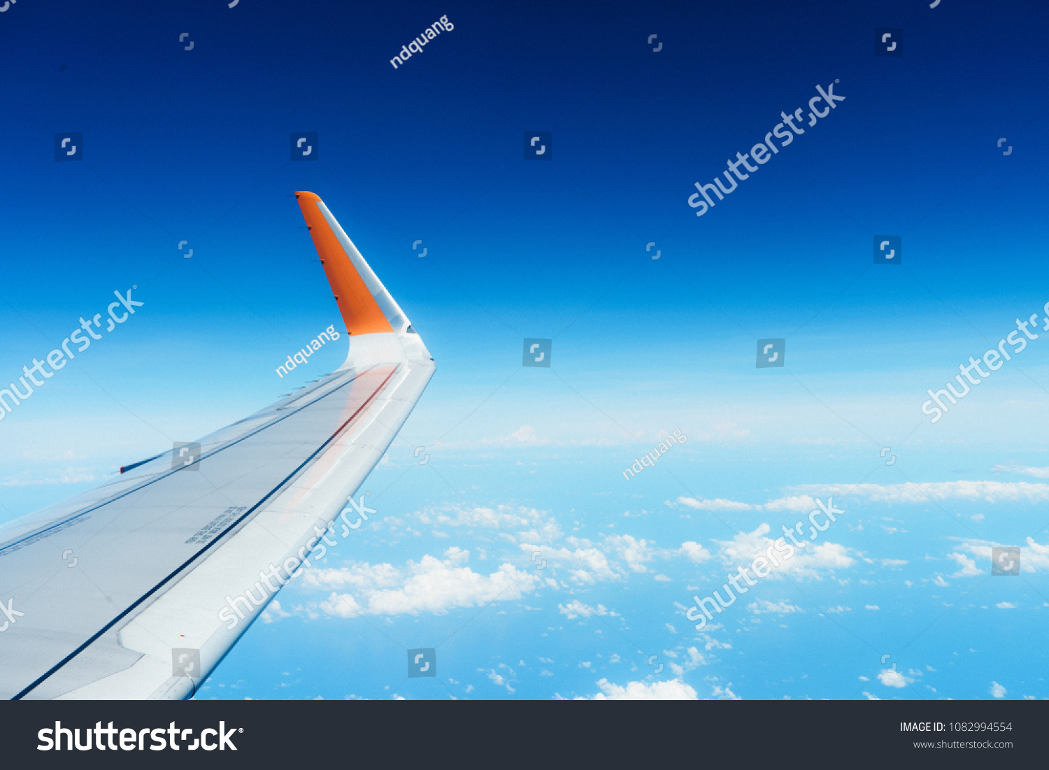 Airfoil and Cloudy Blue sky #1082994554