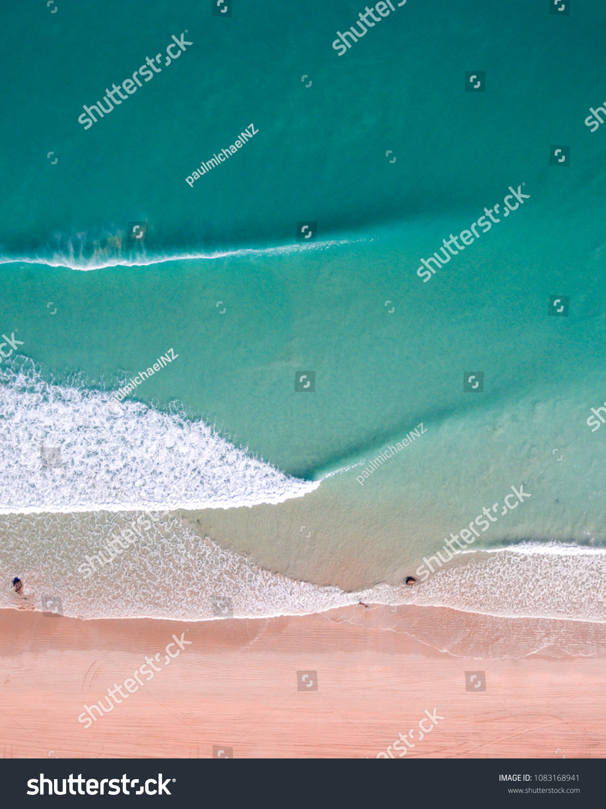 An aerial view of waves crashing on Cable Beach in Broome, Western Australia.  #1083168941