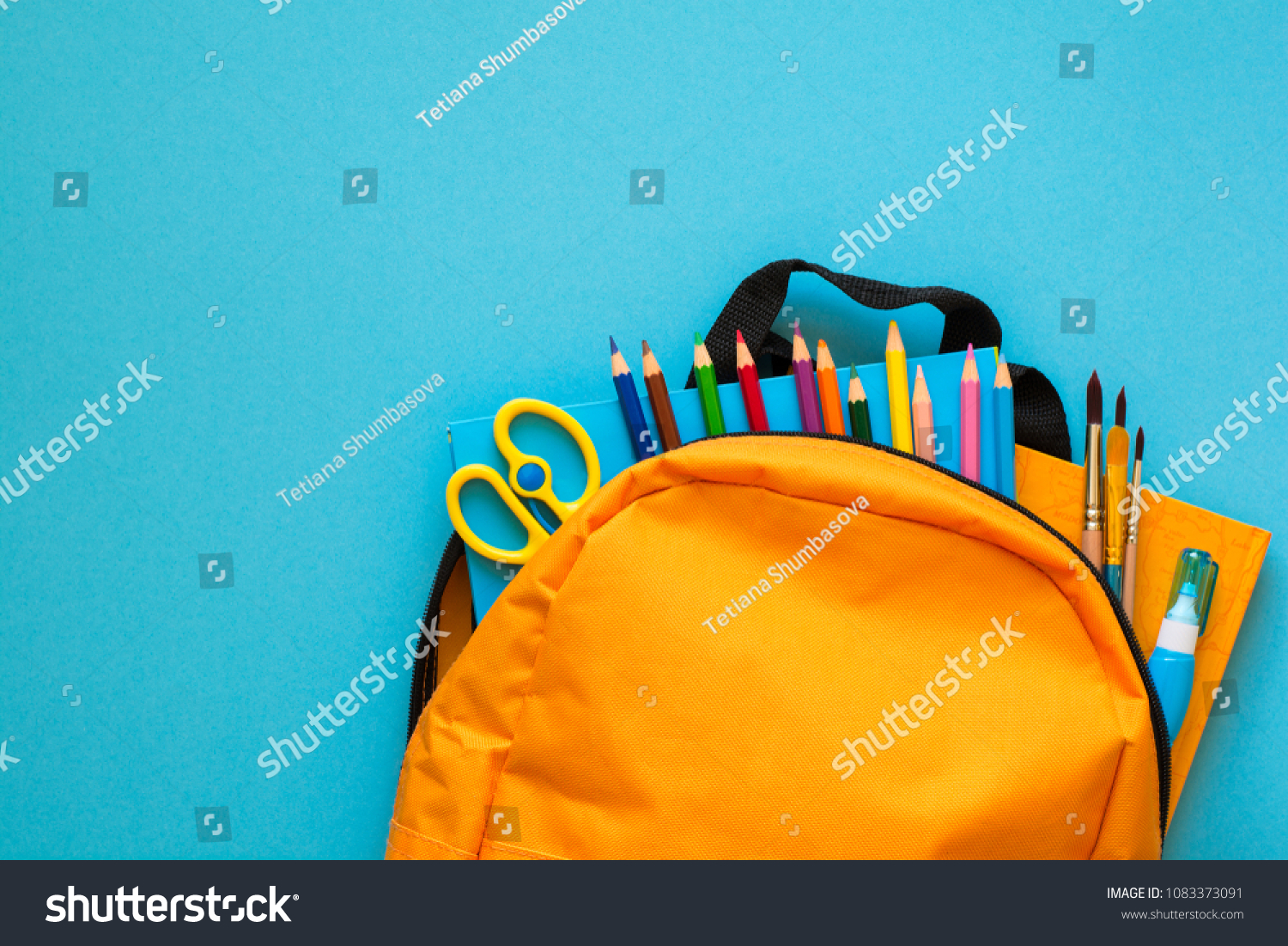 Back to school concept. Backpack with school supplies. Top view. Copy space #1083373091