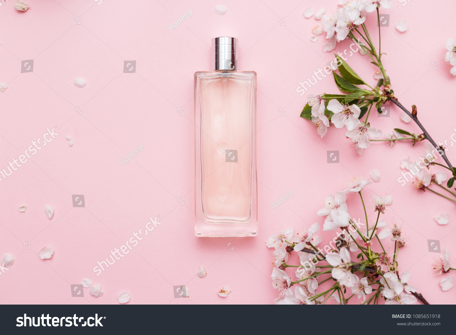 Floral perfume bottle with orchid flowers #1085651918