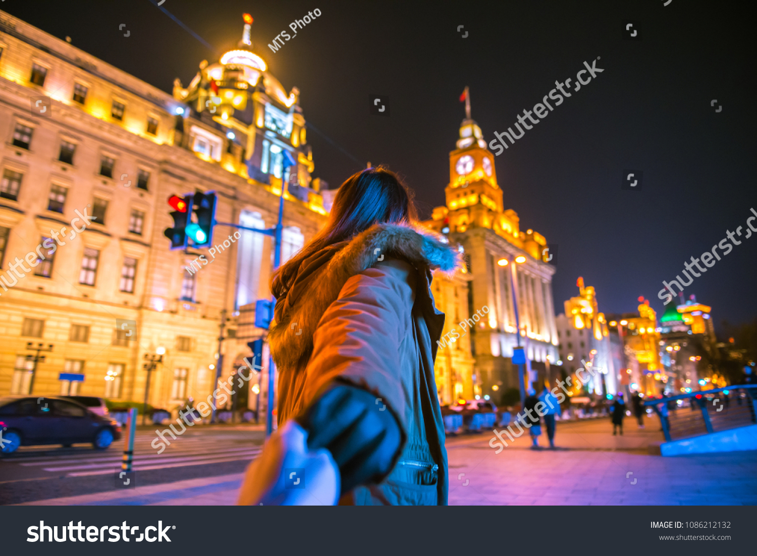 Woman in jacket clothes leading man to the bund in shanghai. Traveling together. Follow me. #1086212132