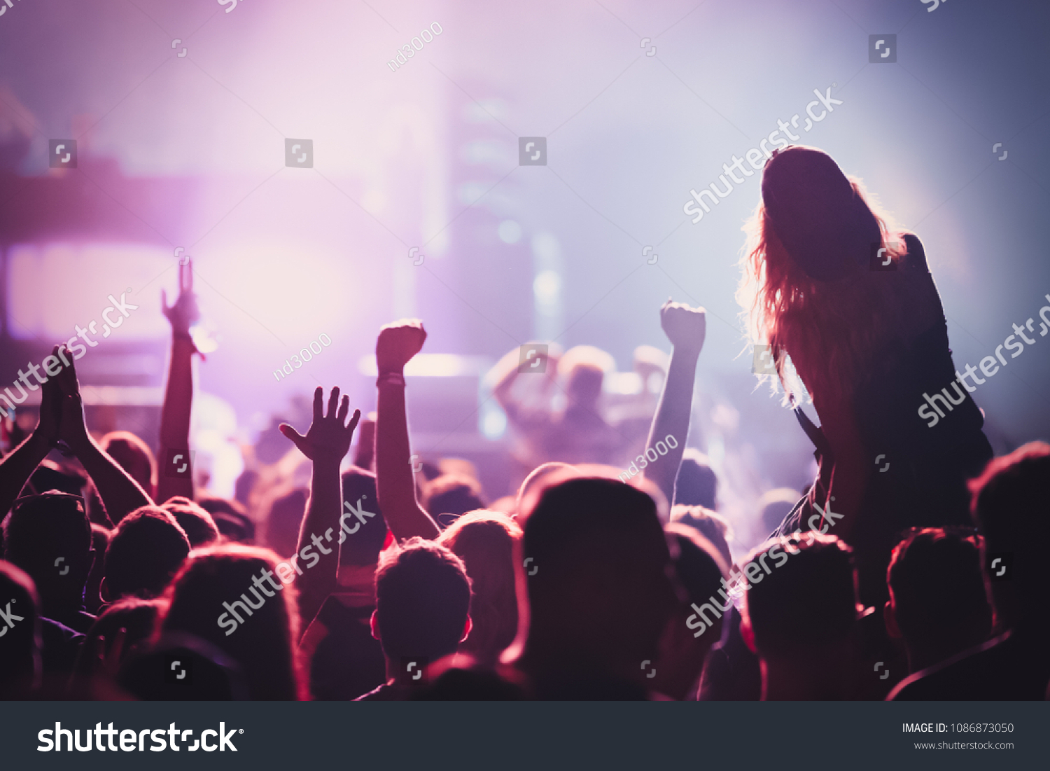 Picture of dancing crowd at music festival #1086873050