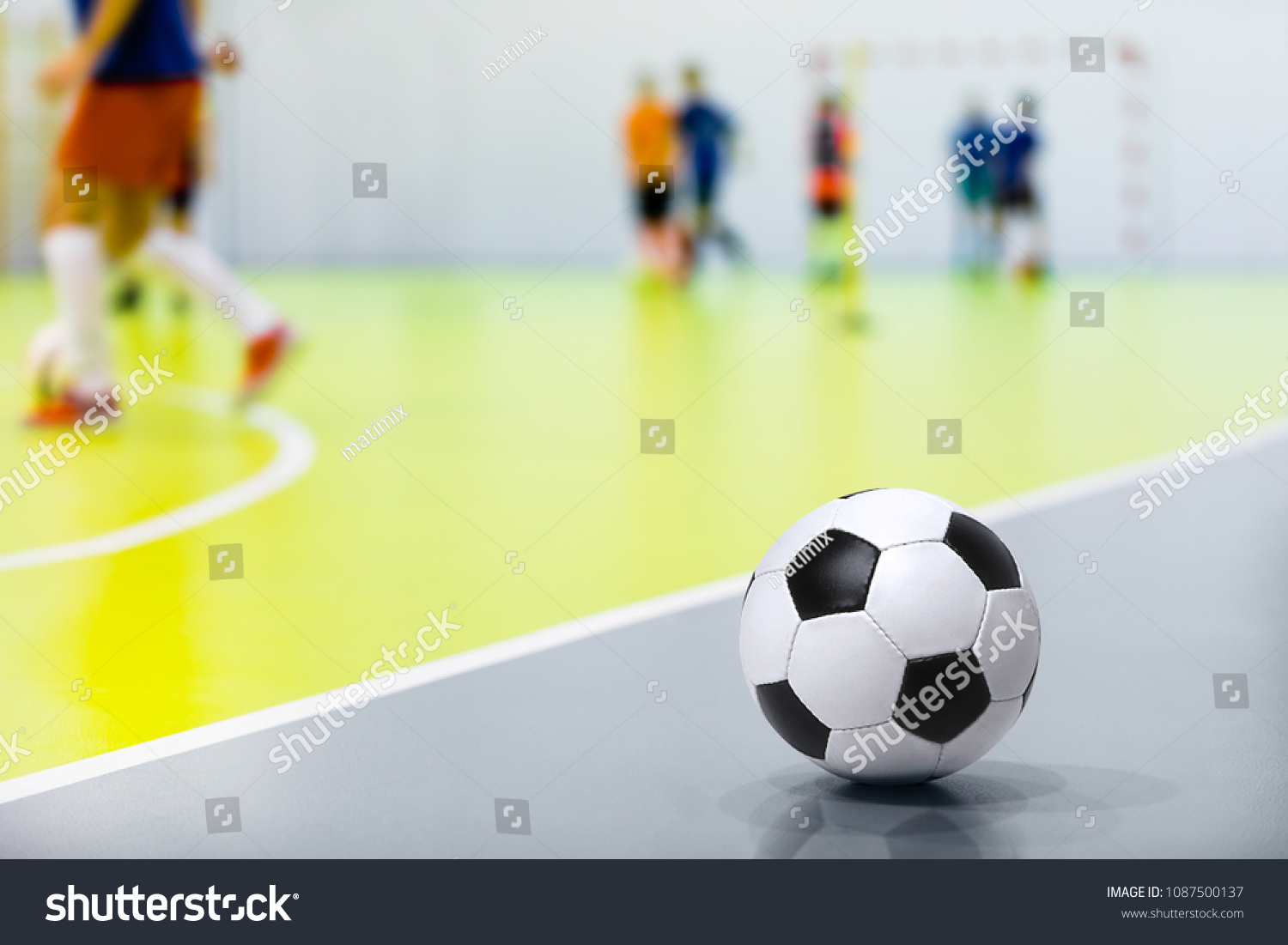 Futsal Background. Indoor Soccer Futsal Ball. Indoor Soccer Match in the Background. Futsal Sports Hall and Futsal Field. Youth Indoor Soccer League.  #1087500137
