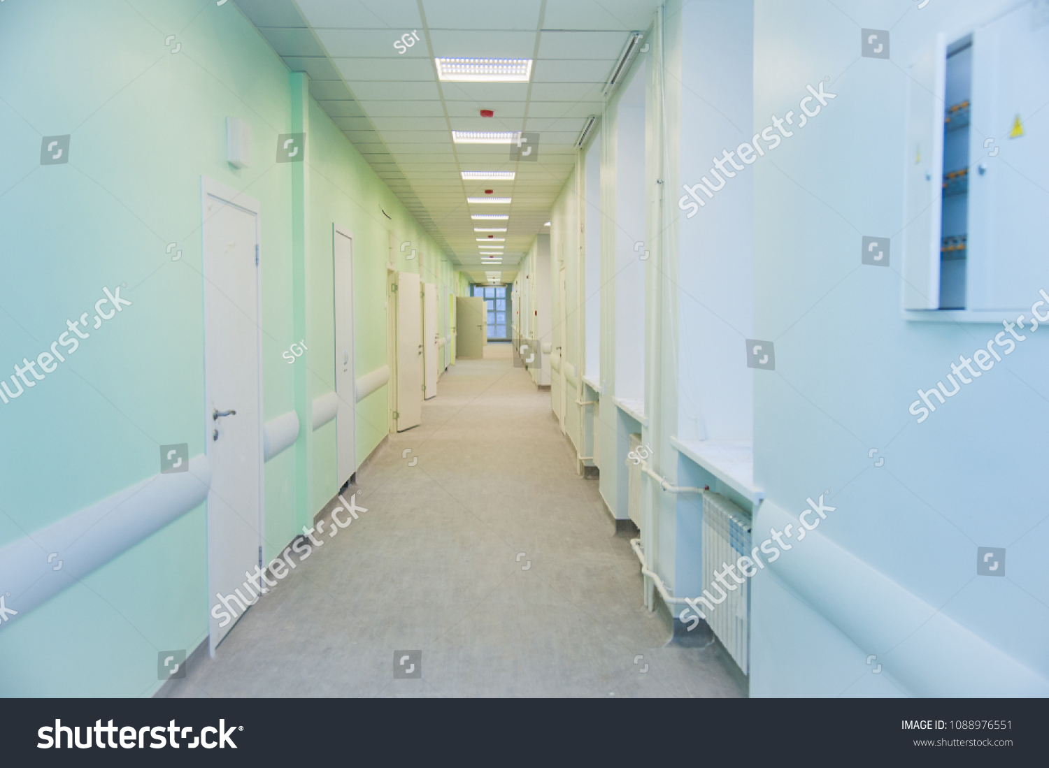 Deep hospital corridor, detail of a corridor in a hospital #1088976551