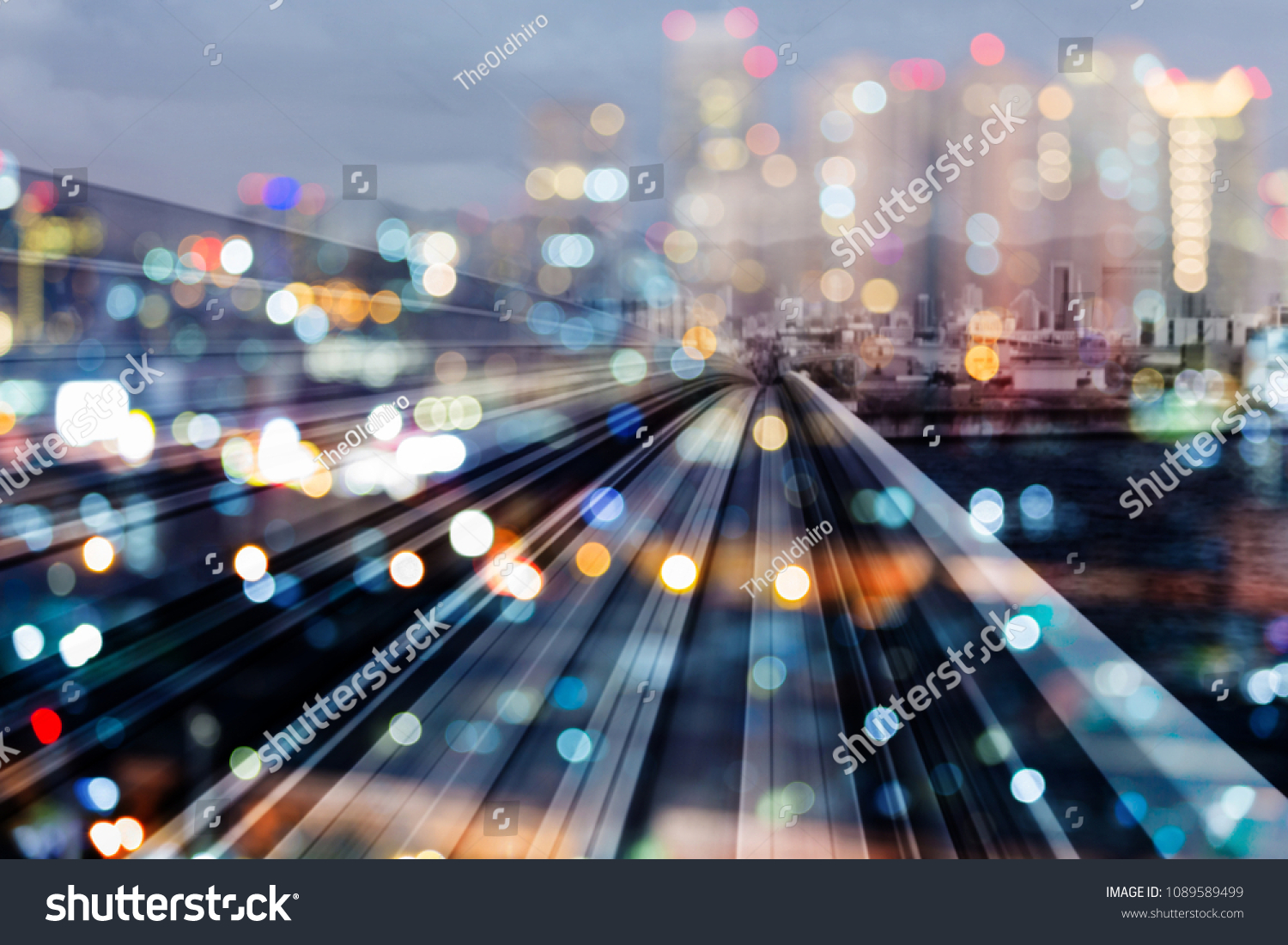 Bokeh city downtown night light with train track over, abstract background #1089589499