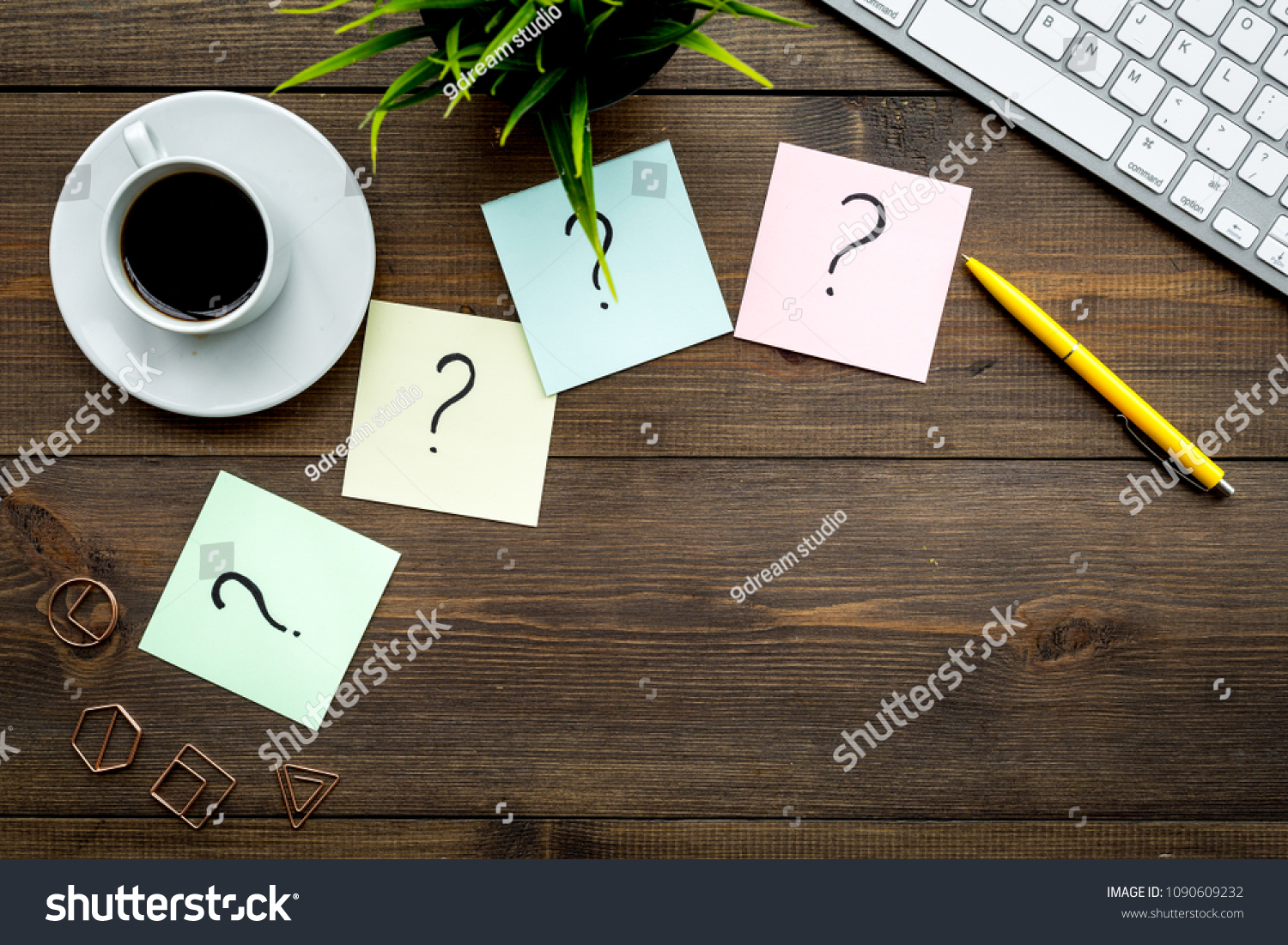 Question mark on sticky notes on office desk on dark wooden background top view copy space. FAQ concept. Working with clients. Troubles in work. #1090609232